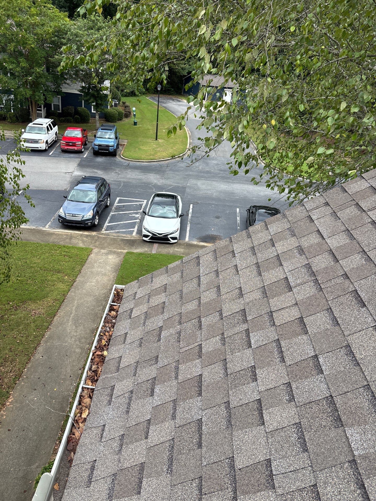 Commercial gutter cleaning Warner Robins & Perry, GA before photo with filled gutters