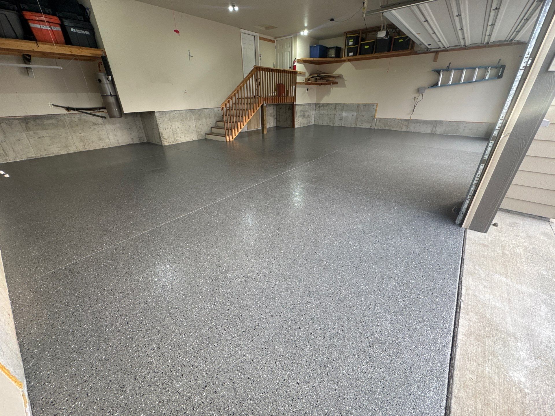 Custom Gray Speckled Polyaspartic Garage Floor Coating in Cheney by Croc Coatings, LLC