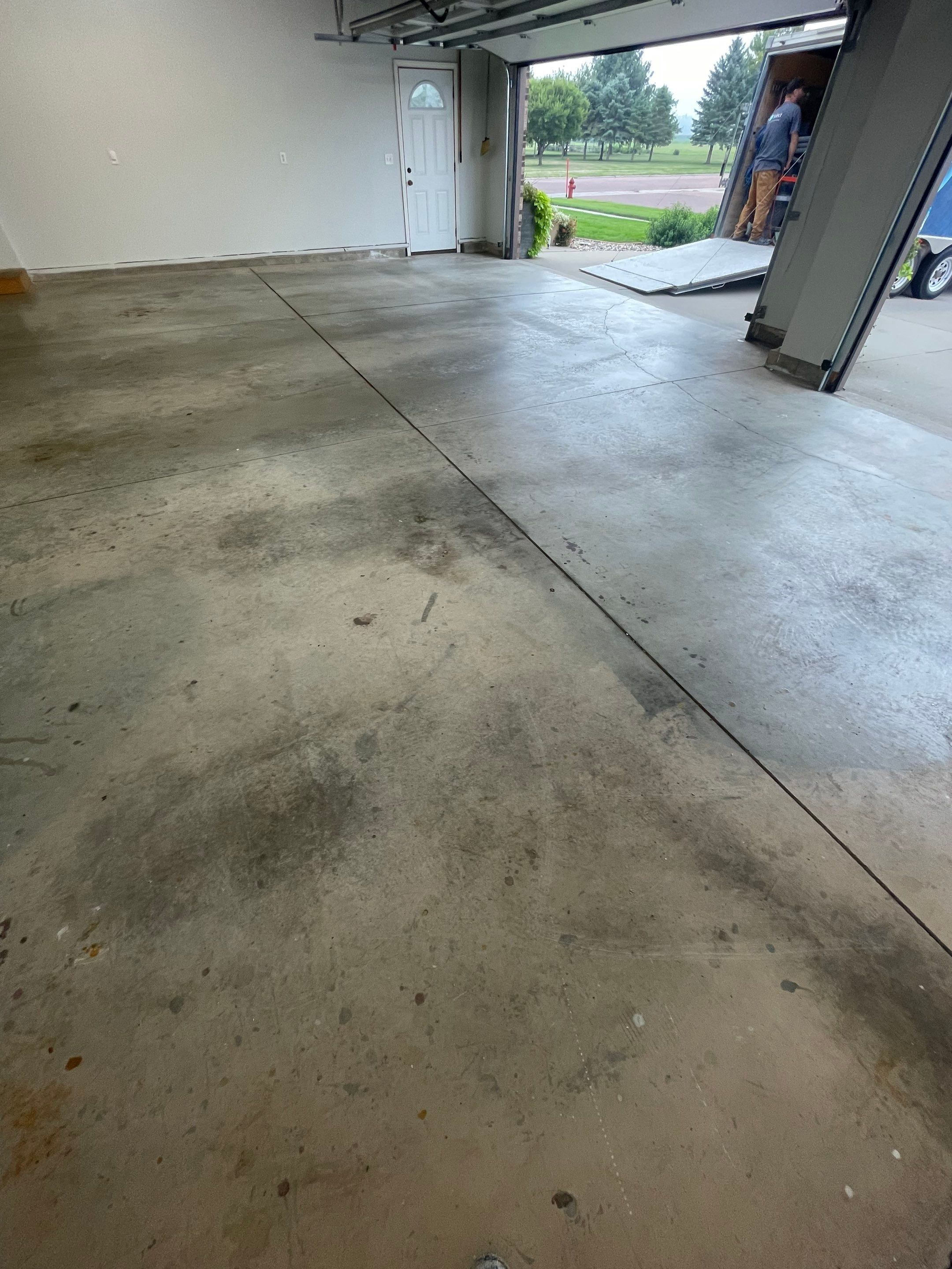 Multi-Car Garage Floor Coating and Crack Repair in Tea by Select Painting, Coatings & Garage Cabinets