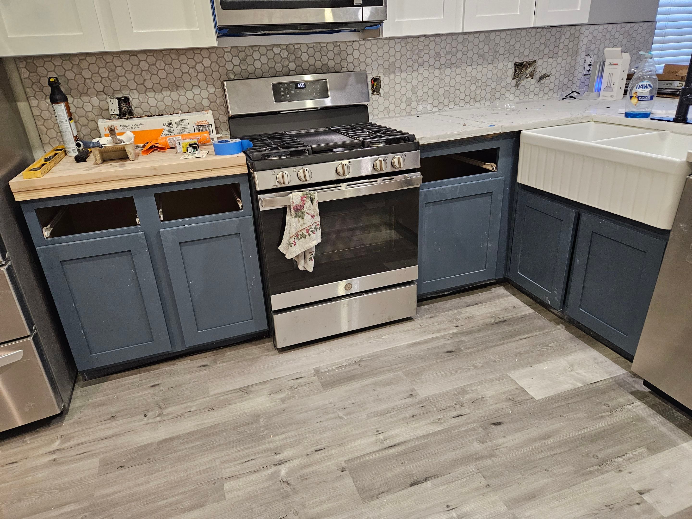 Modern Kitchen Remodel with Blue Cabinetry by Majesty Construction