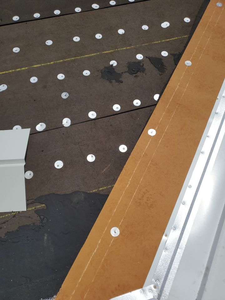 Residential Roofing Installation using 1.5" Nail Strip 24ga Solar White Kynar Coated Standing Seam Metal Panels by Morton Roofing, Inc.