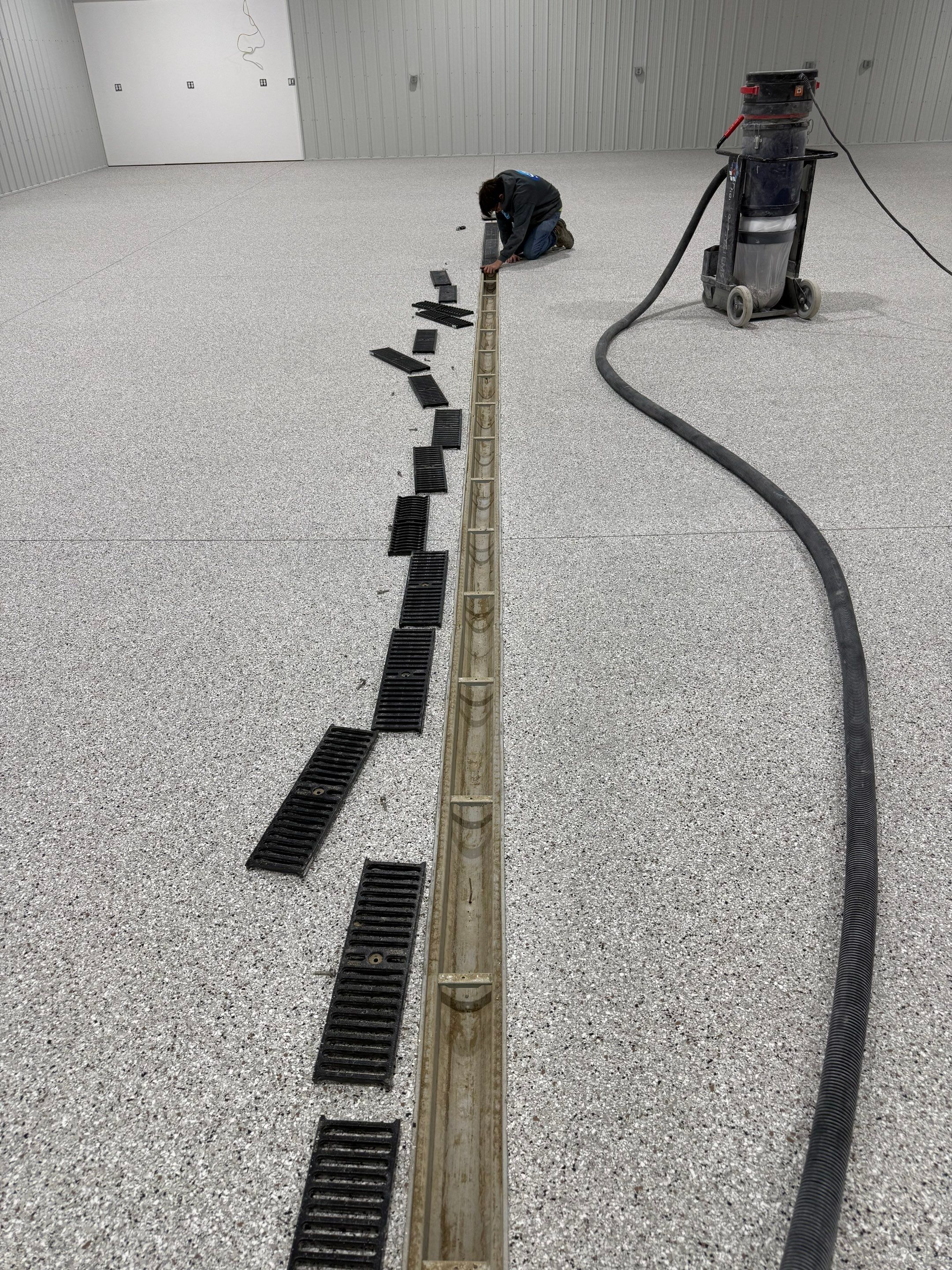 Custom Speckled Floor Coating for Large Montrose Shop by Select Painting, Coatings & Garage Cabinets