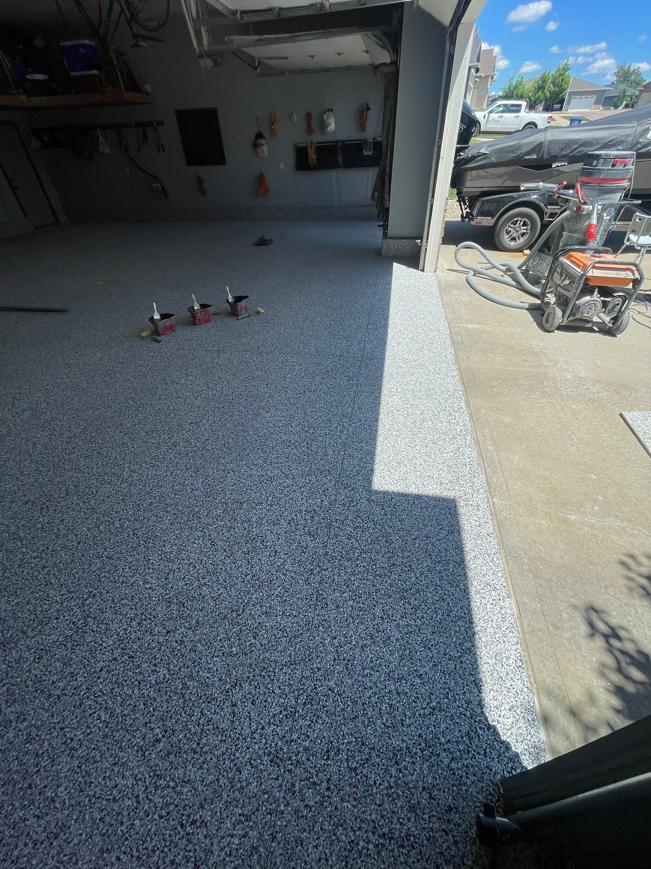 Residential Garage Floor Coating in Sioux Falls by Select Painting, Coatings & Garage Cabinets