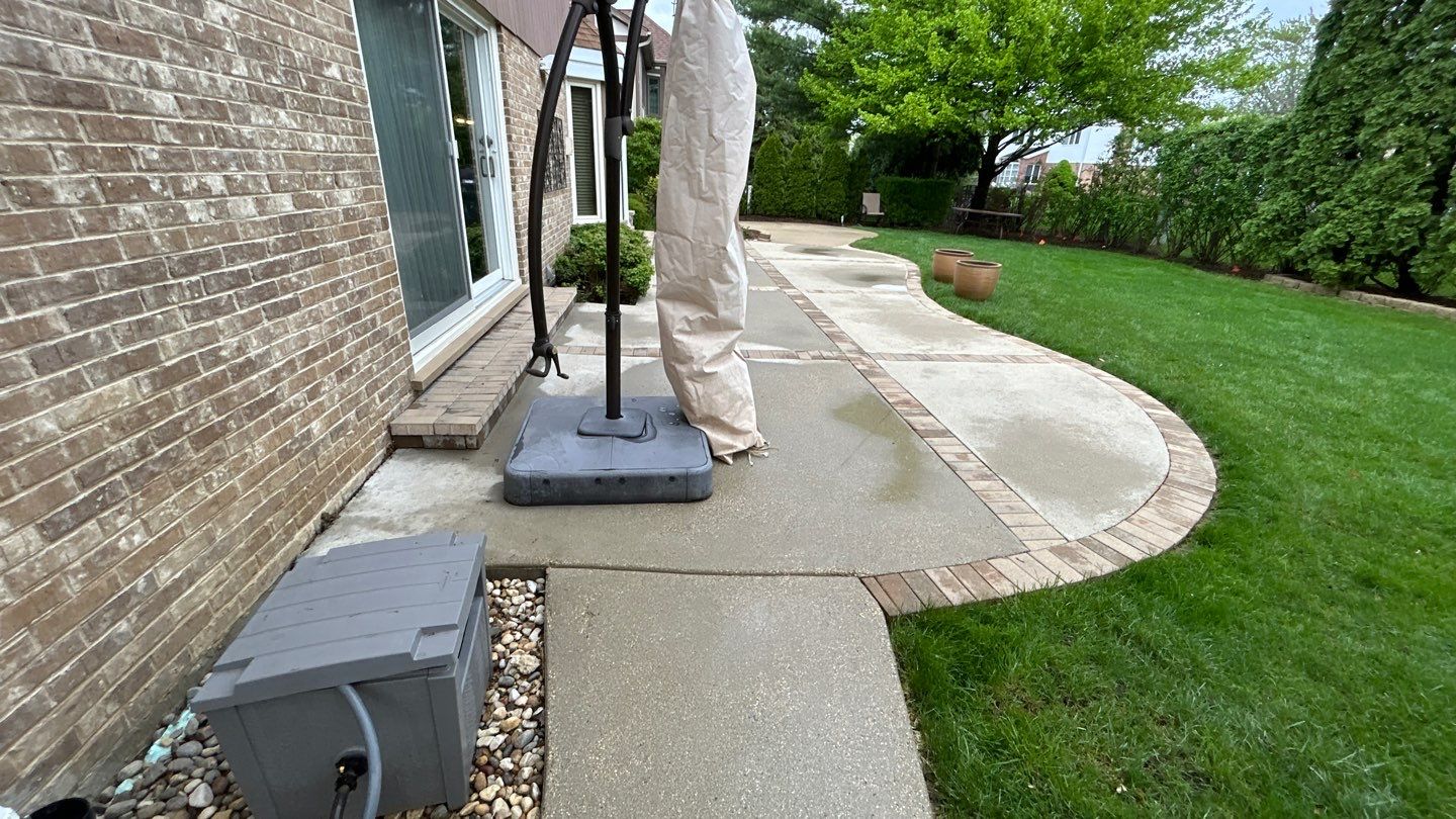 concrete patio and driveway cleaning by Northern Power Washing LLC.