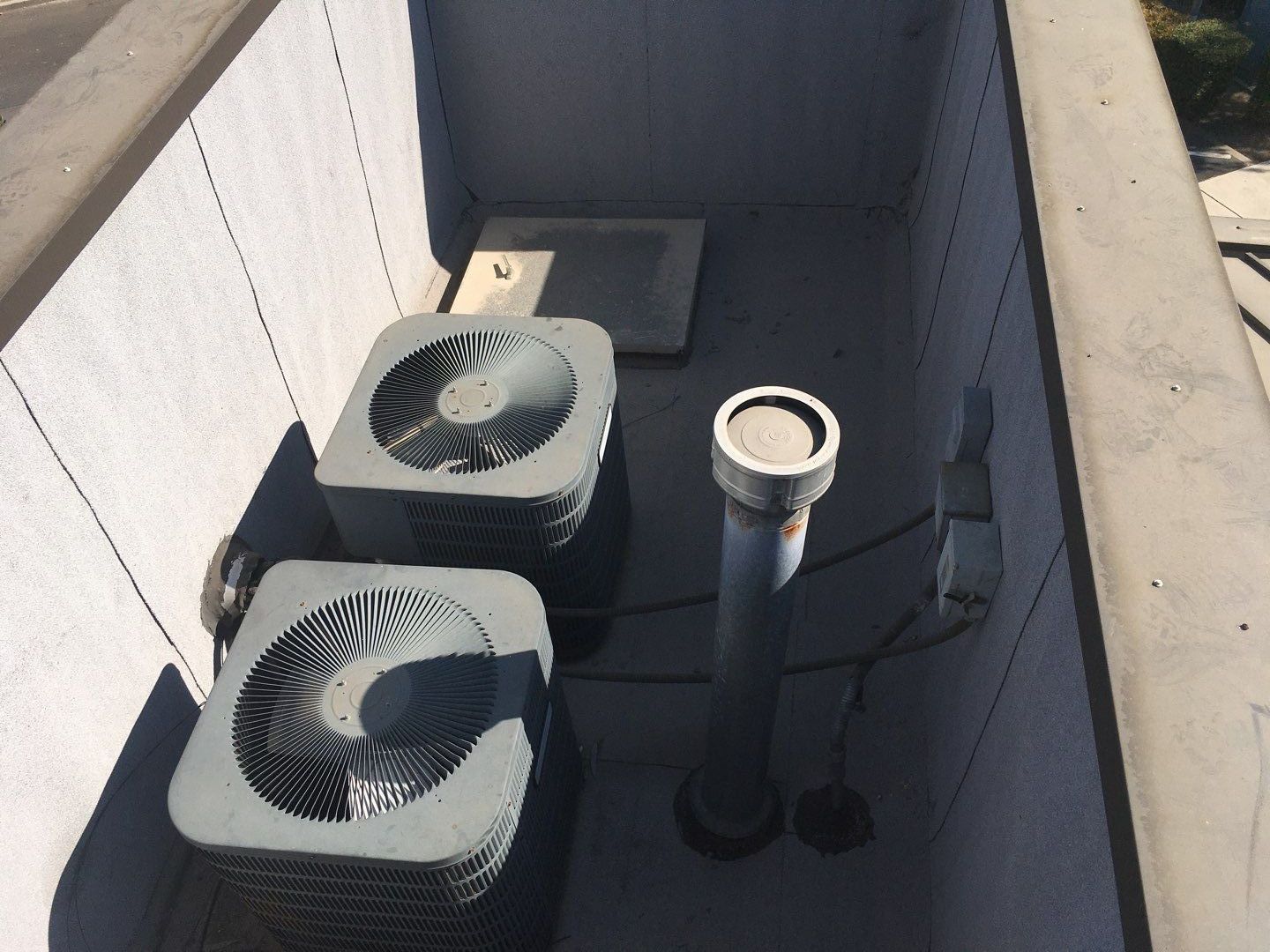 Spray foam and coatings inside commercial building HVAC well using Spray foam and coatings over existing BUR system by Straight Edge Roofing Inc