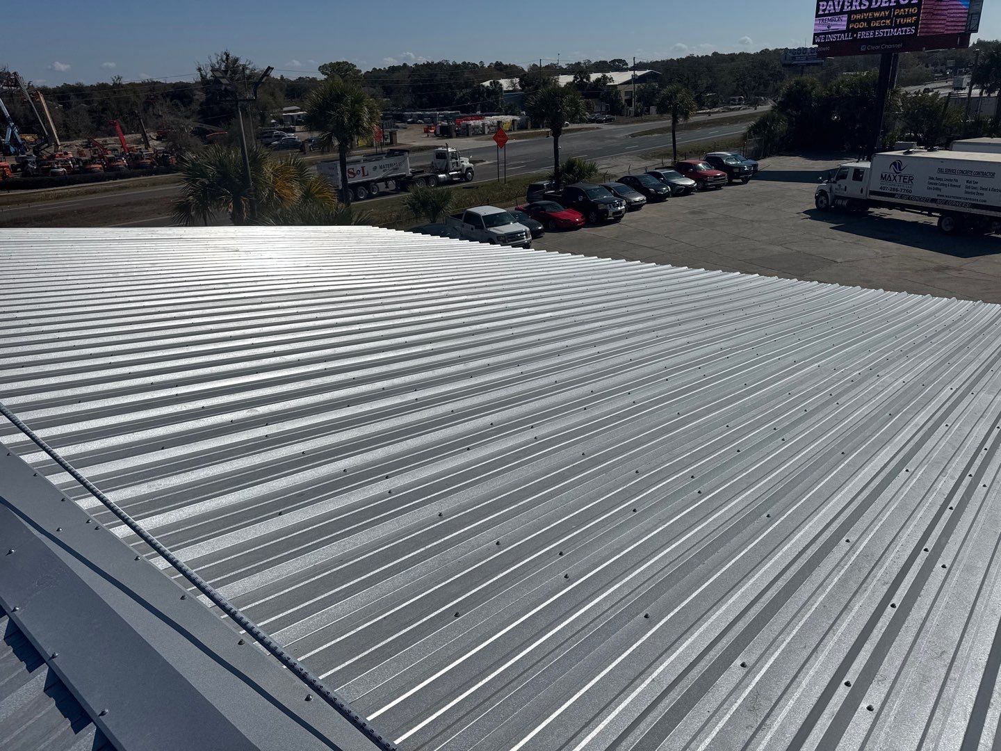 Commercial Metal Roof Replacement for Industrial Warehouses in Orlando by Tip Top Roofing Co., Inc.