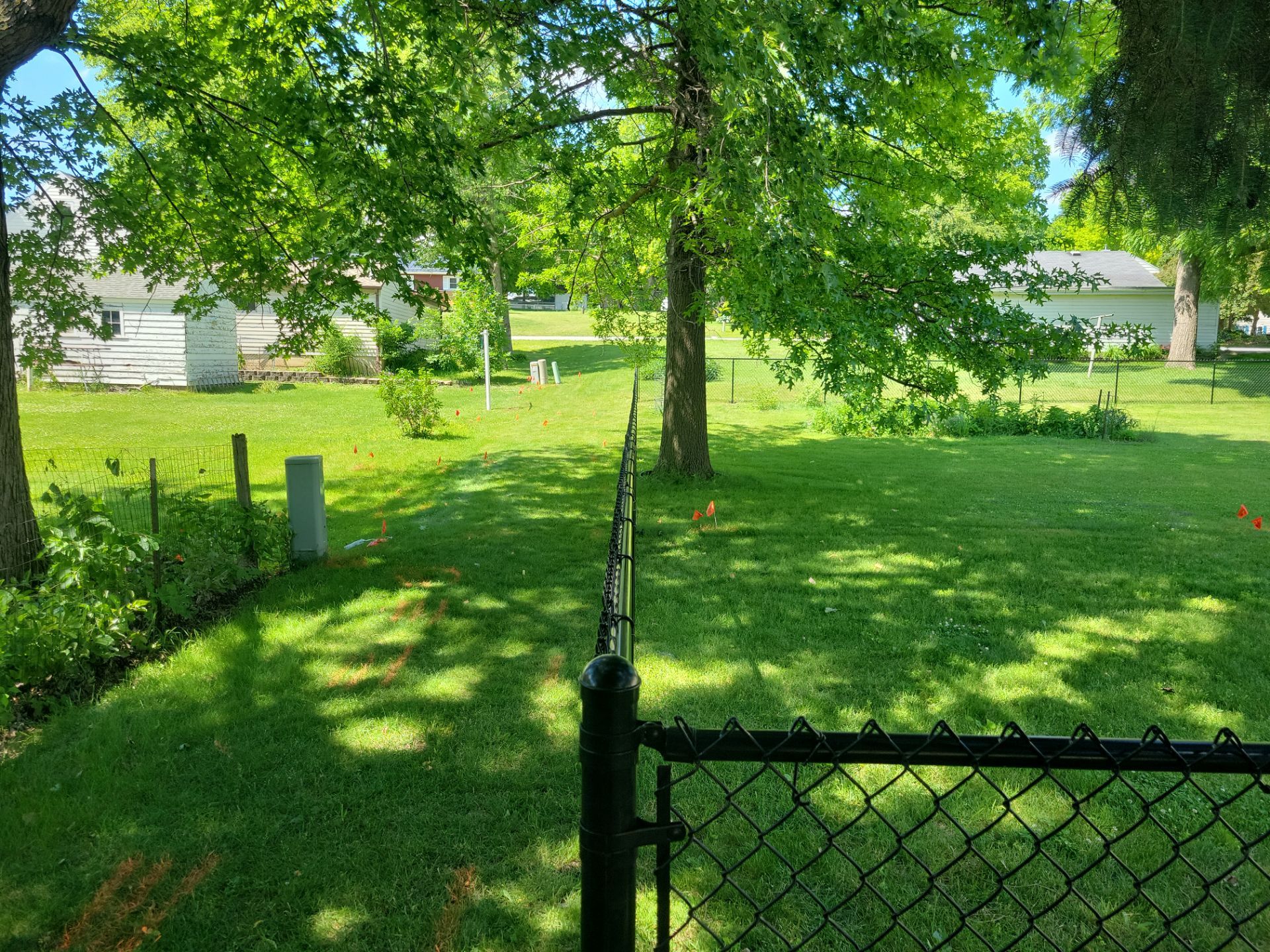 Black Chain Link Perimeter Fence and Driveway Gate in Waverly by Perfect Picket Fence and Stain