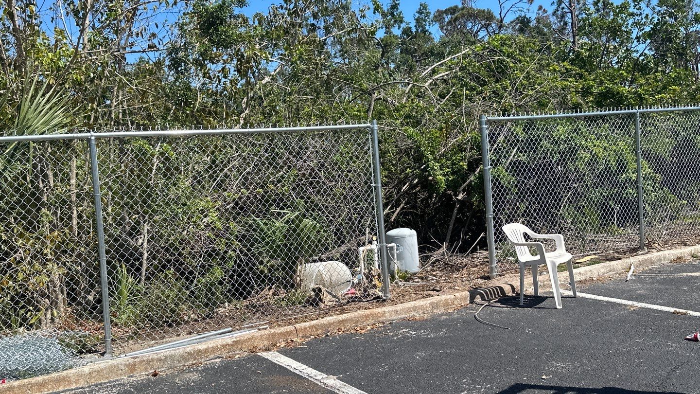 Commercial Chainlink and Vinyl Fence With Aluminum Framed Gates On Dumpster Enclosure by Asap fence and gates, LLC