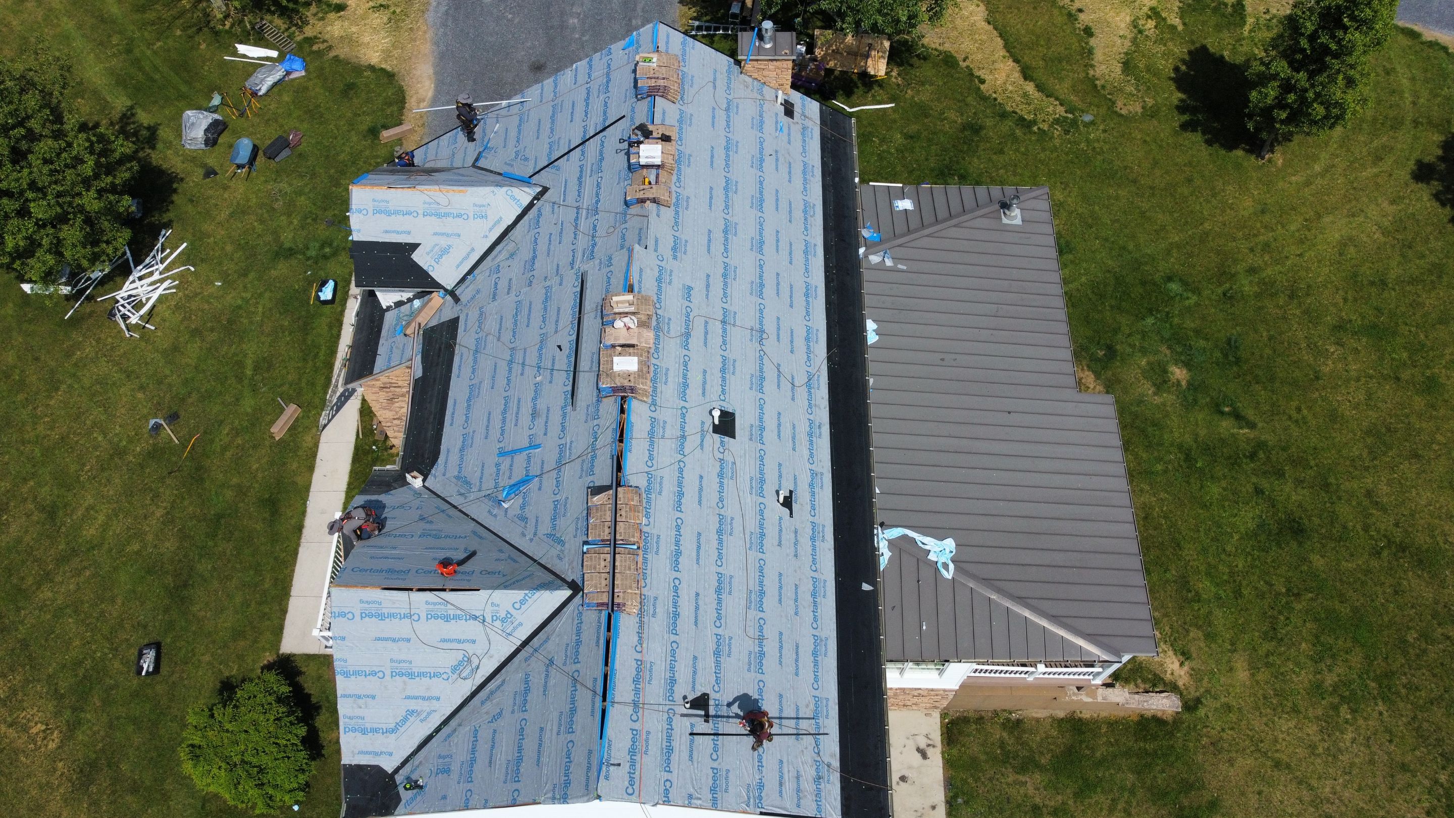Roof Damage using Certainteed Lifetime Roofing System- Moire Black Landmark Pro shingkes with shadow ridge caps. by BulletpROOF Exteriors