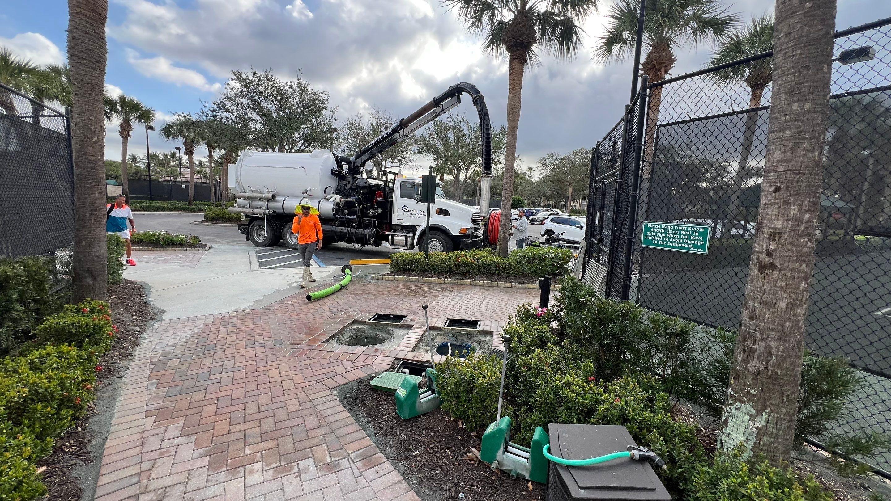 Pelican Landing Tennis Court Catch Basin Cleaning by APS Power & Water
