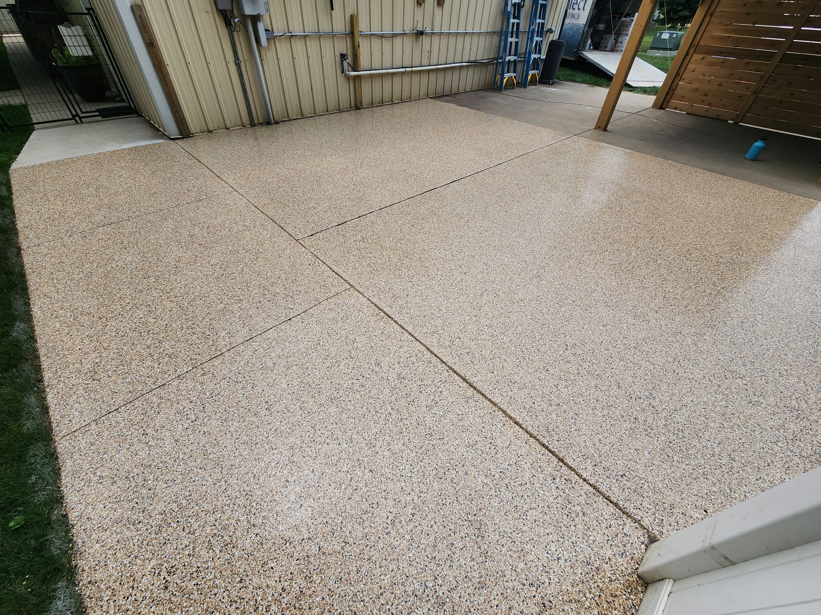 Speckled Epoxy Concrete Patio Coating Installation in Hurley by Select Painting, Coatings & Garage Cabinets