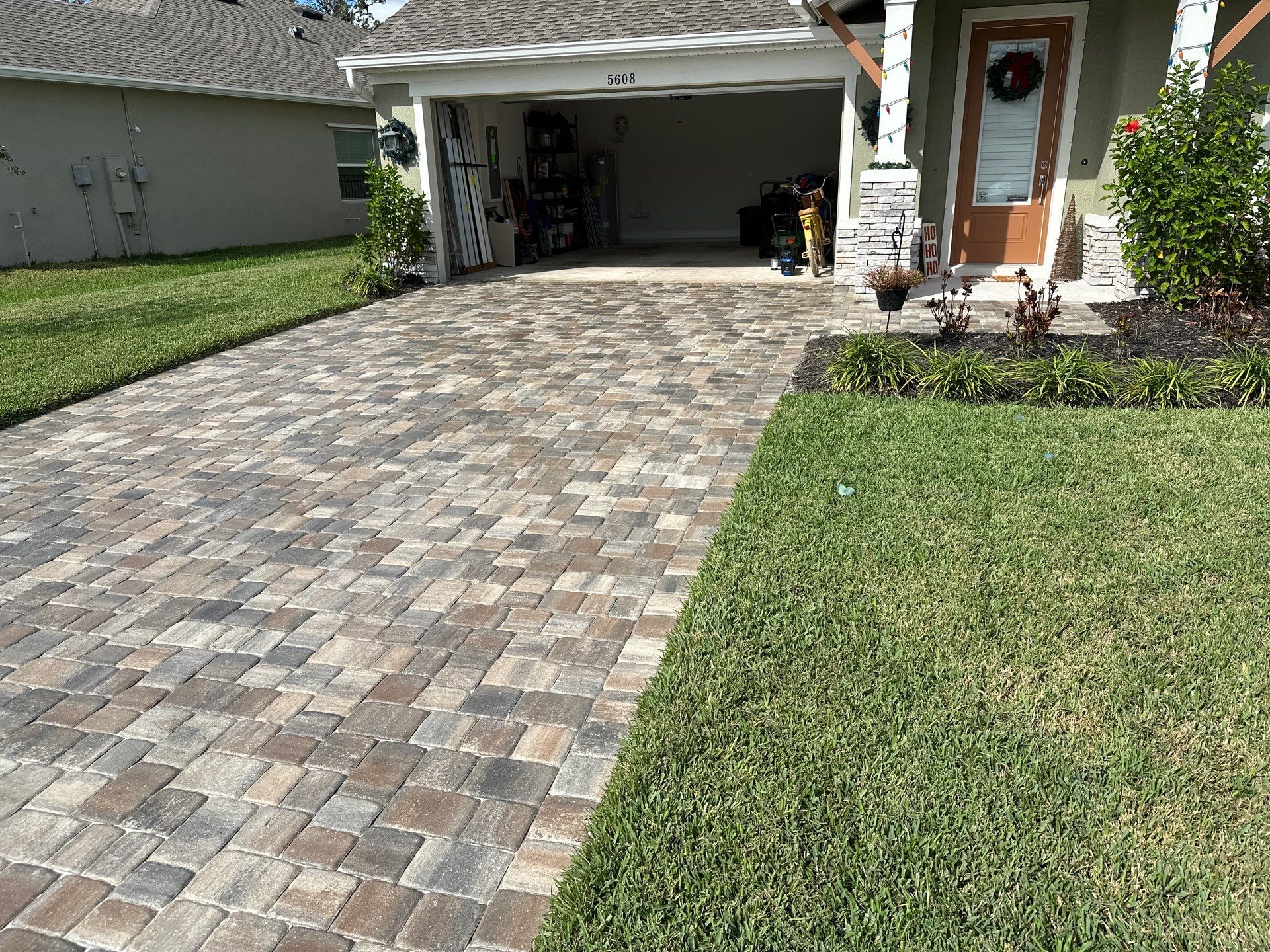 House Wash, Paver Driveway & Sidewalk Cleaning + Sanding & Sealing in Trevesta Community, Palmetto, FL by Sunshine AquaWash