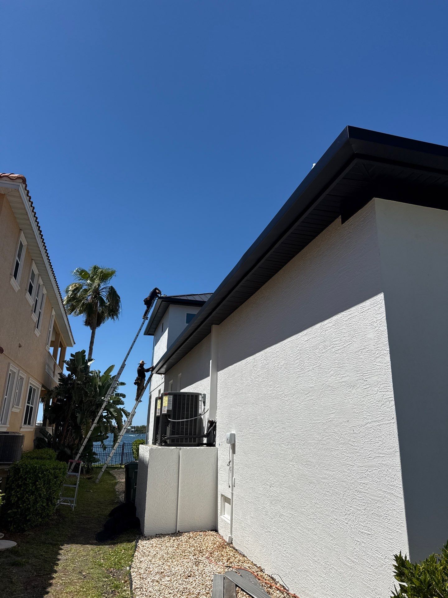 Soffit and Fascia Installation and black seamless gutters in Sarasota FL by Gutter Professors