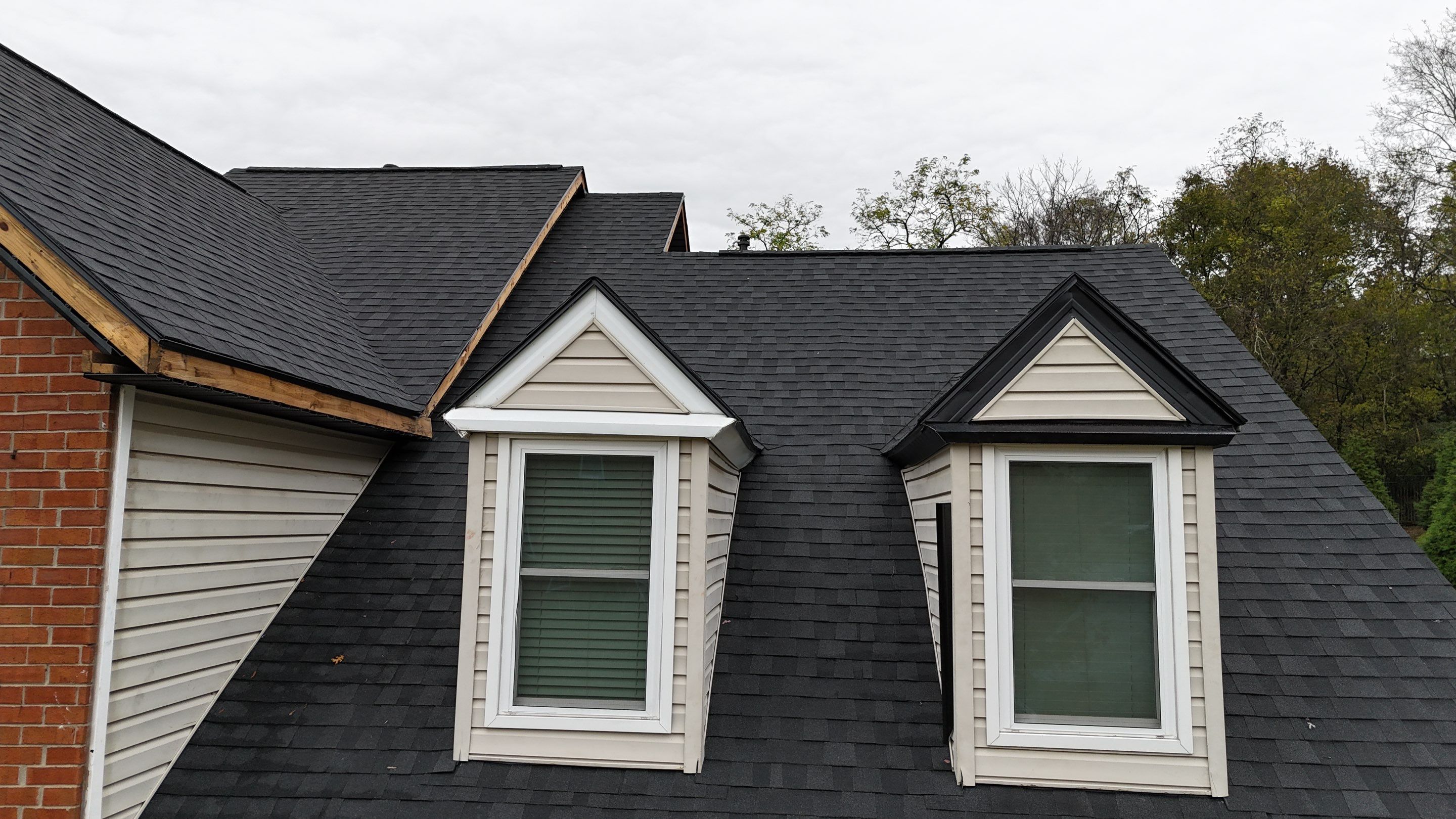 Charcoal Black Re-Roof & Gutters by Royal House LLC