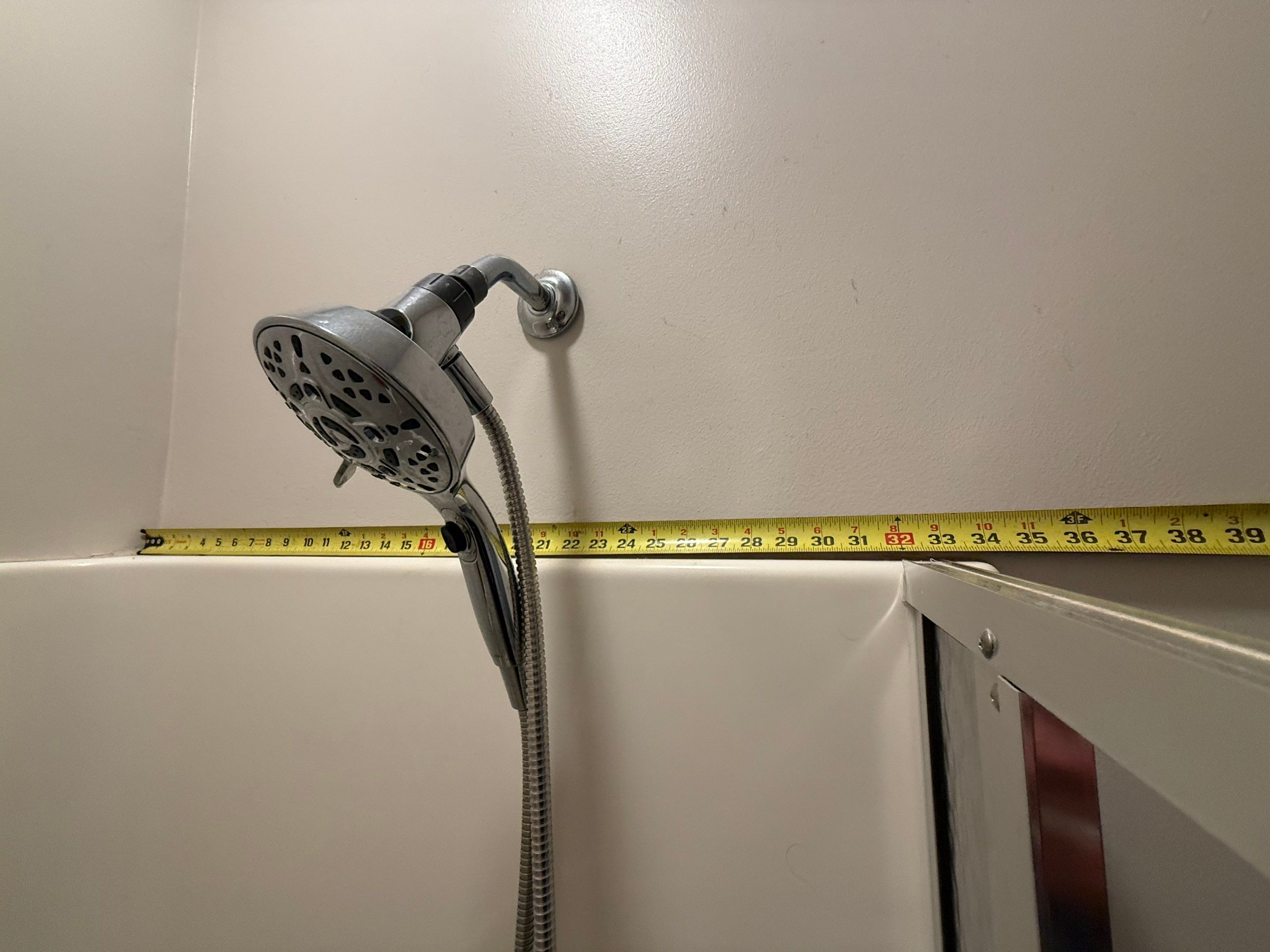 East Jordan Walk-In Shower Remodel with Folding Bench and Chrome Fixtures by Rainbow Seamless Systems