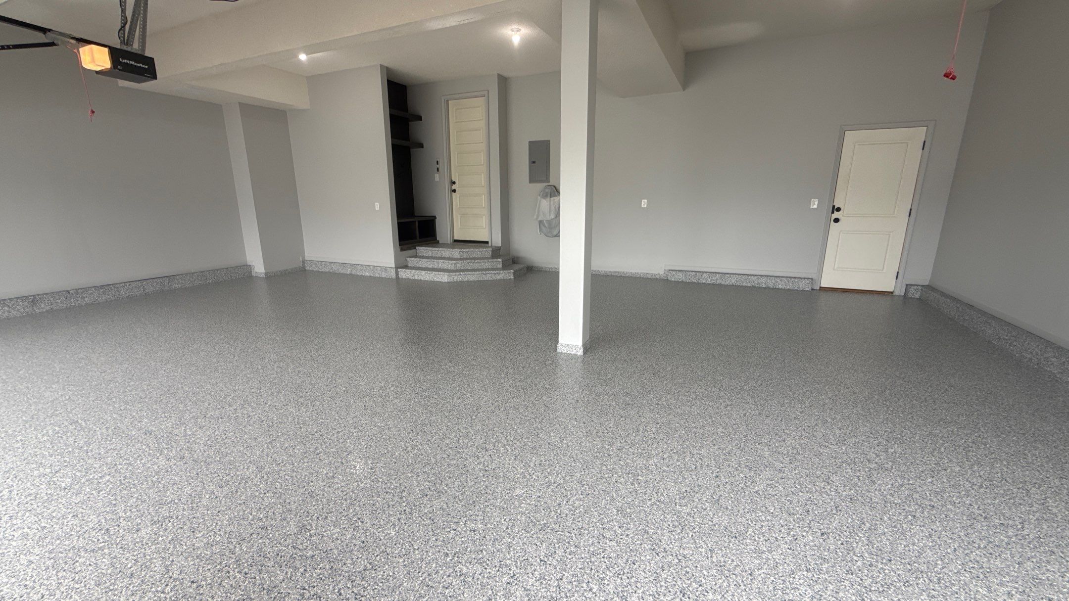Comprehensive Garage Renovation Featuring Epoxy Flooring and Custom Storage in Shawnee by Banner Garage