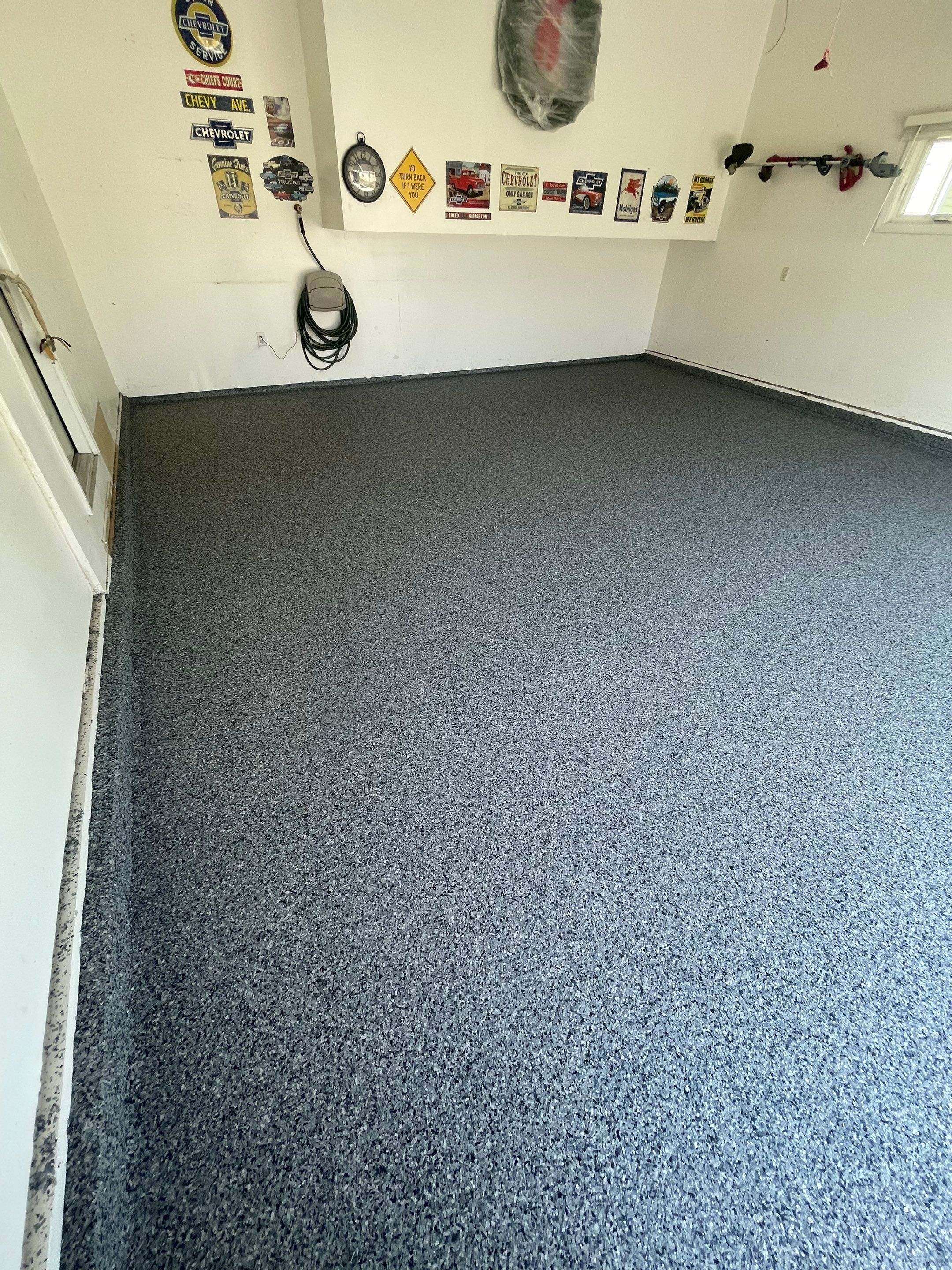 Sioux Falls Garage Floor Coating with Nightfall Decorative Chips by Select Painting, Coatings & Garage Cabinets