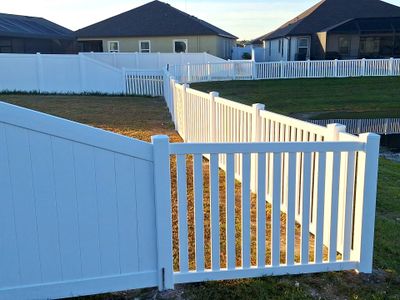 Vinyl Fence Installation using 6Ft White Vinyl Privacy Fence with a 4Ft White Clearwater Picket Fence