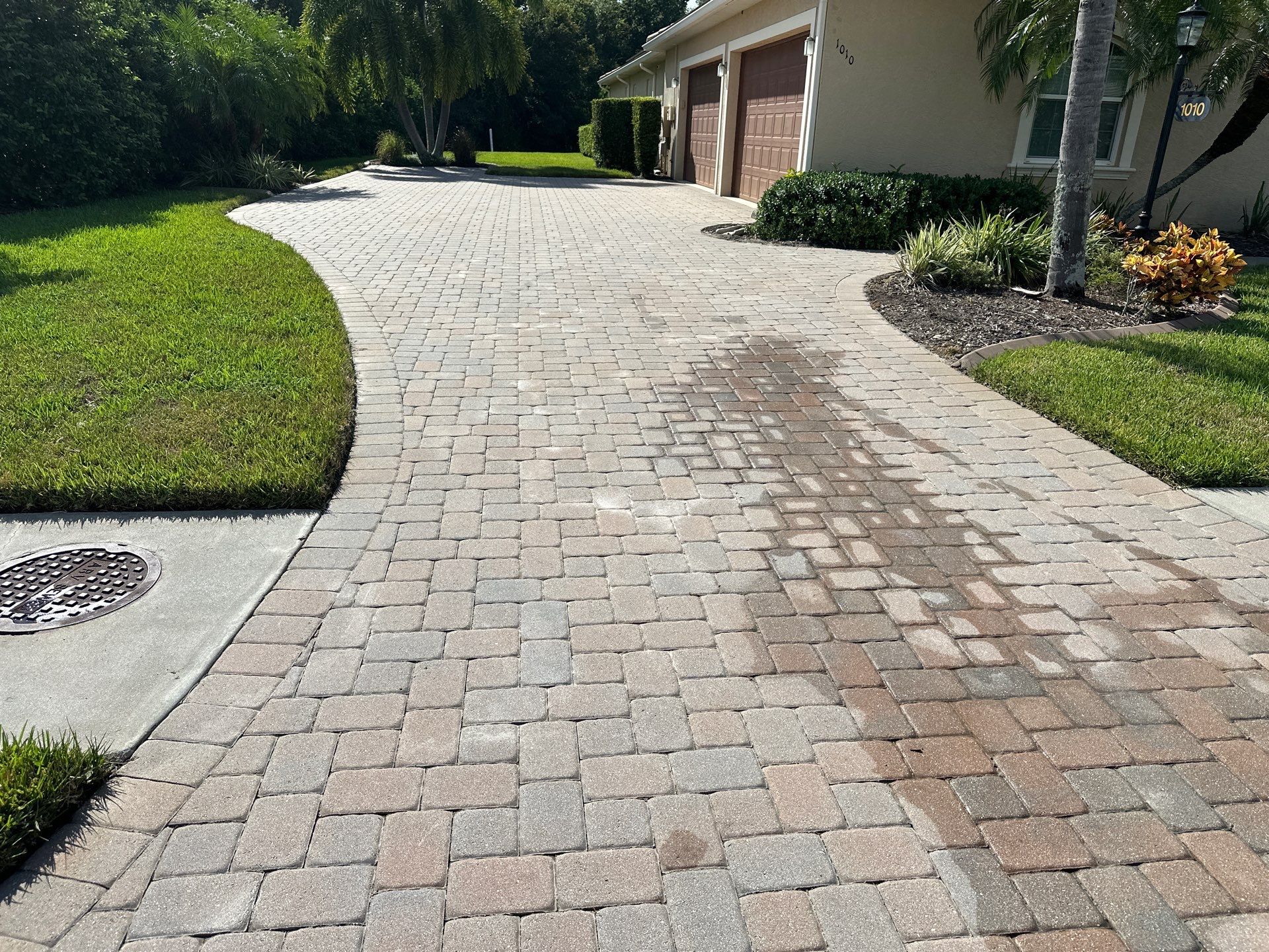 Paver Driveway, Entryway, Sidewalk, and Street Curbing Cleaning in Winding River Community, Bradenton, FL by Sunshine AquaWash