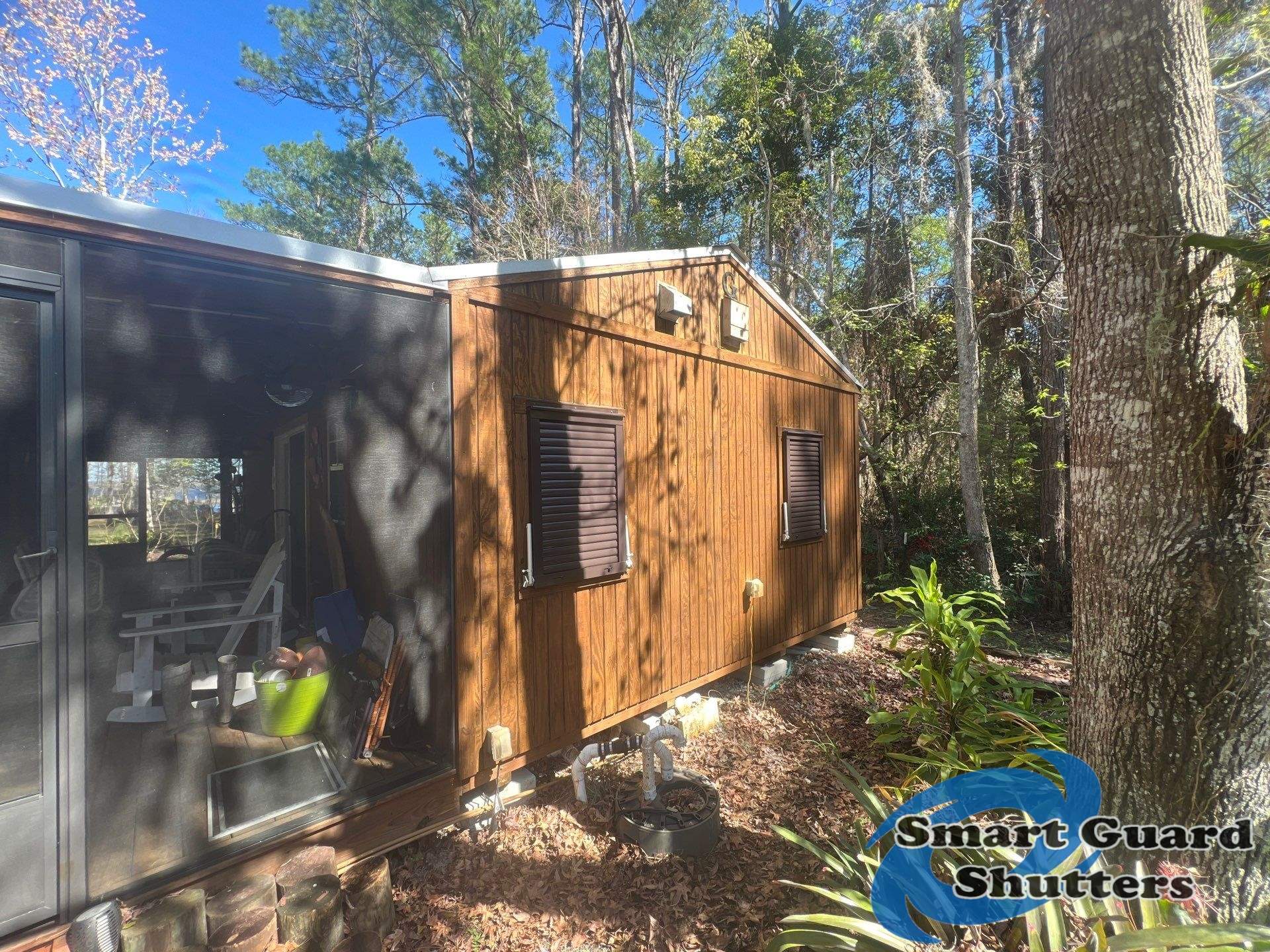 Hurricane Protection in Bronze/Grey Brown by Smart Guard Shutters