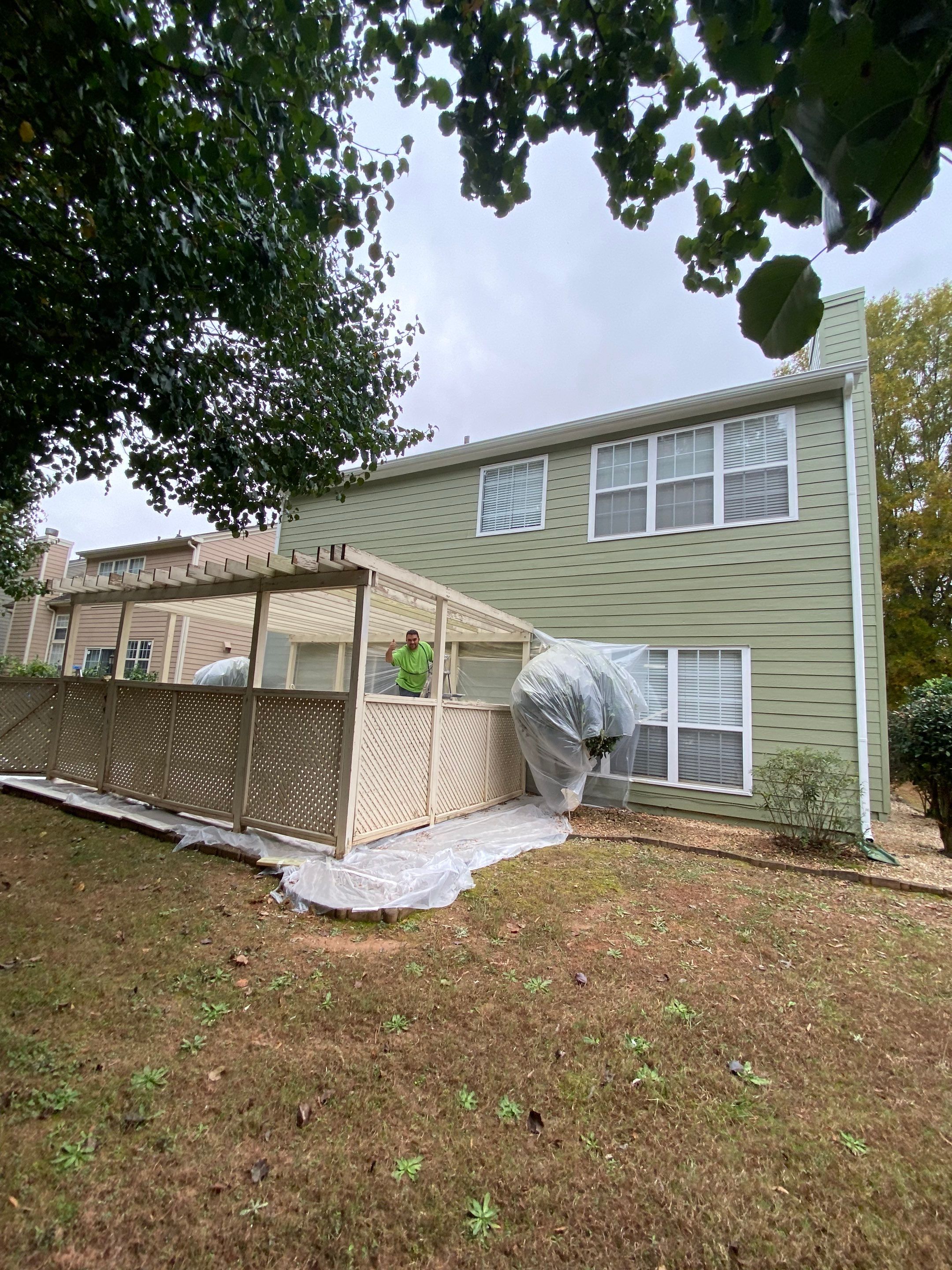 Exterior Painting for a Two-Story Sage Green Home in Kennesaw by Swift Home Renovations