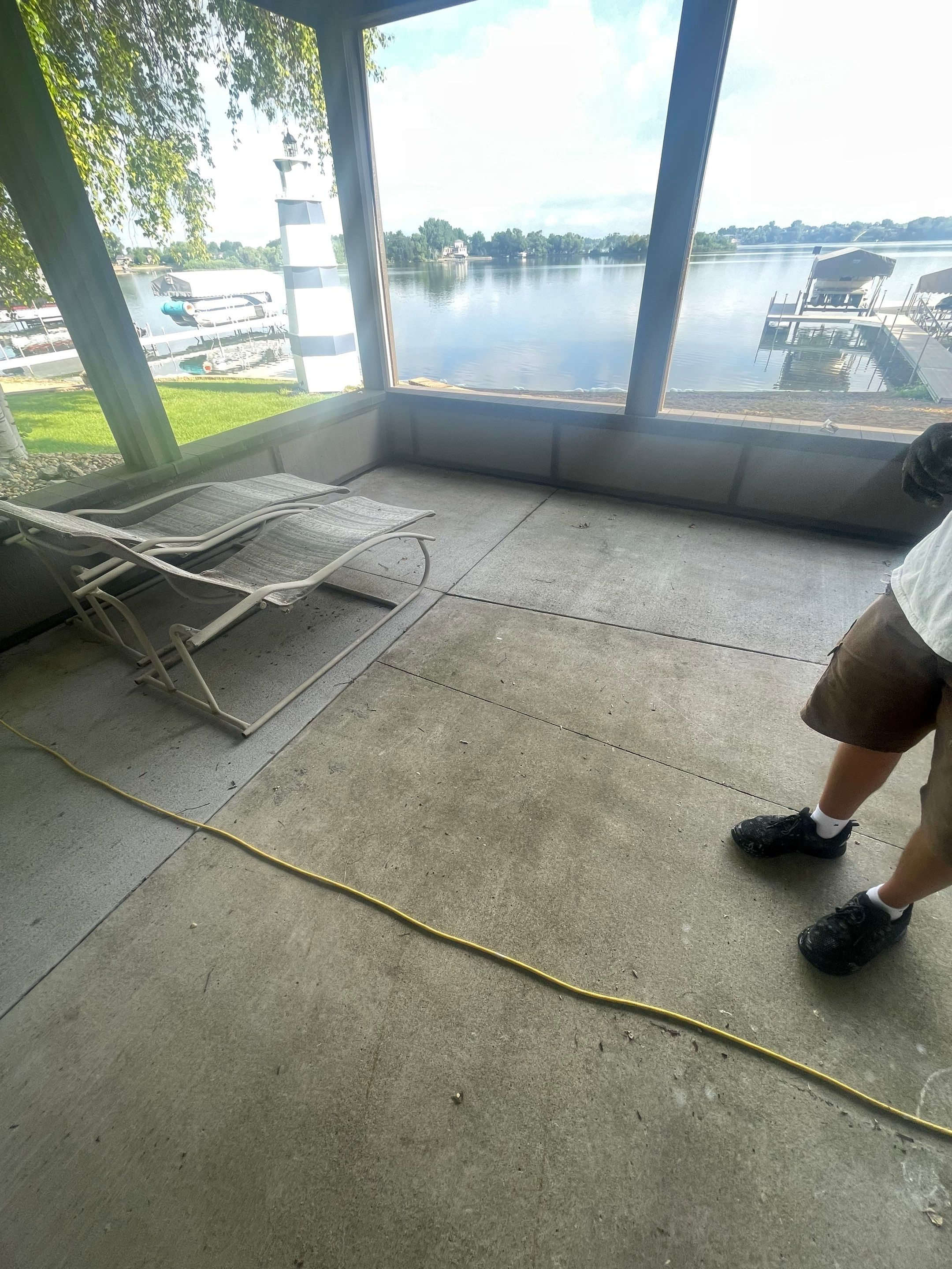 Lakefront Screened Patio Concrete Coating Installation in Wentworth by Select Painting, Coatings & Garage Cabinets
