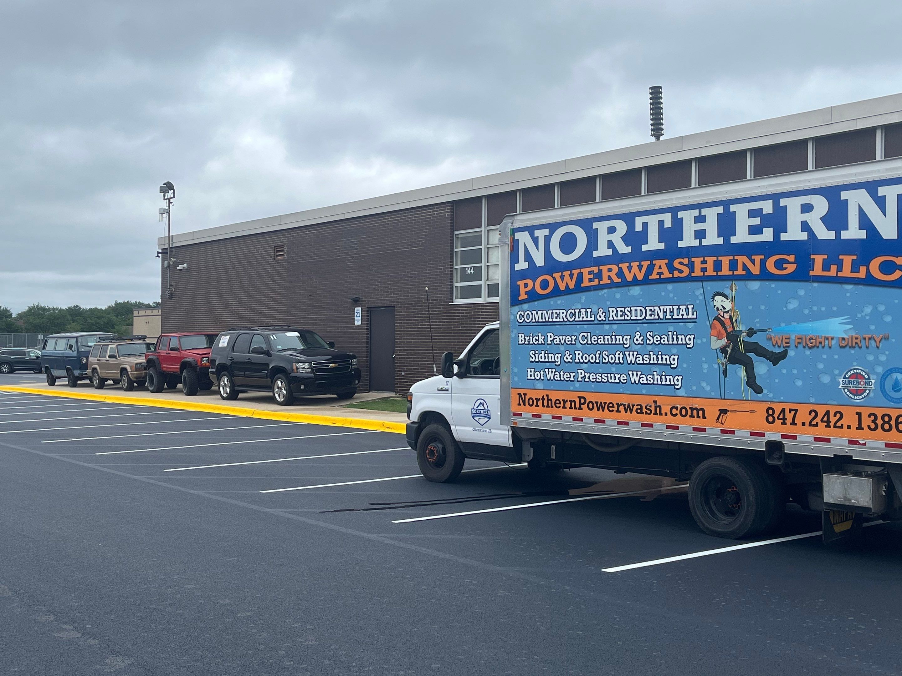 commercial pressure washing using Algaecide, soft wash soap by Northern Power Washing LLC.