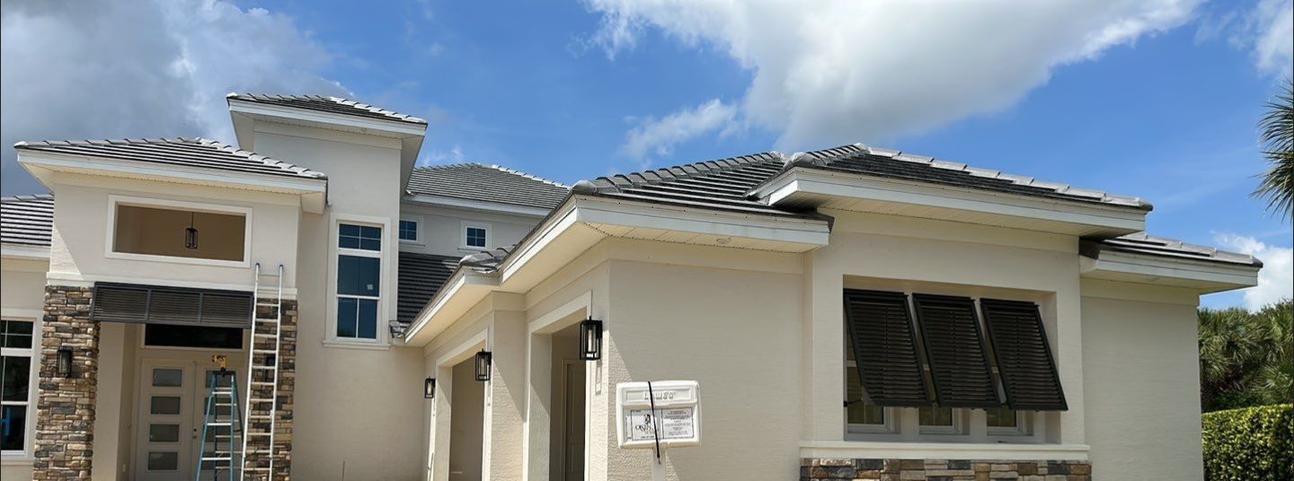 Bahama Shutters in Umbra Gray by Smart Guard Shutters