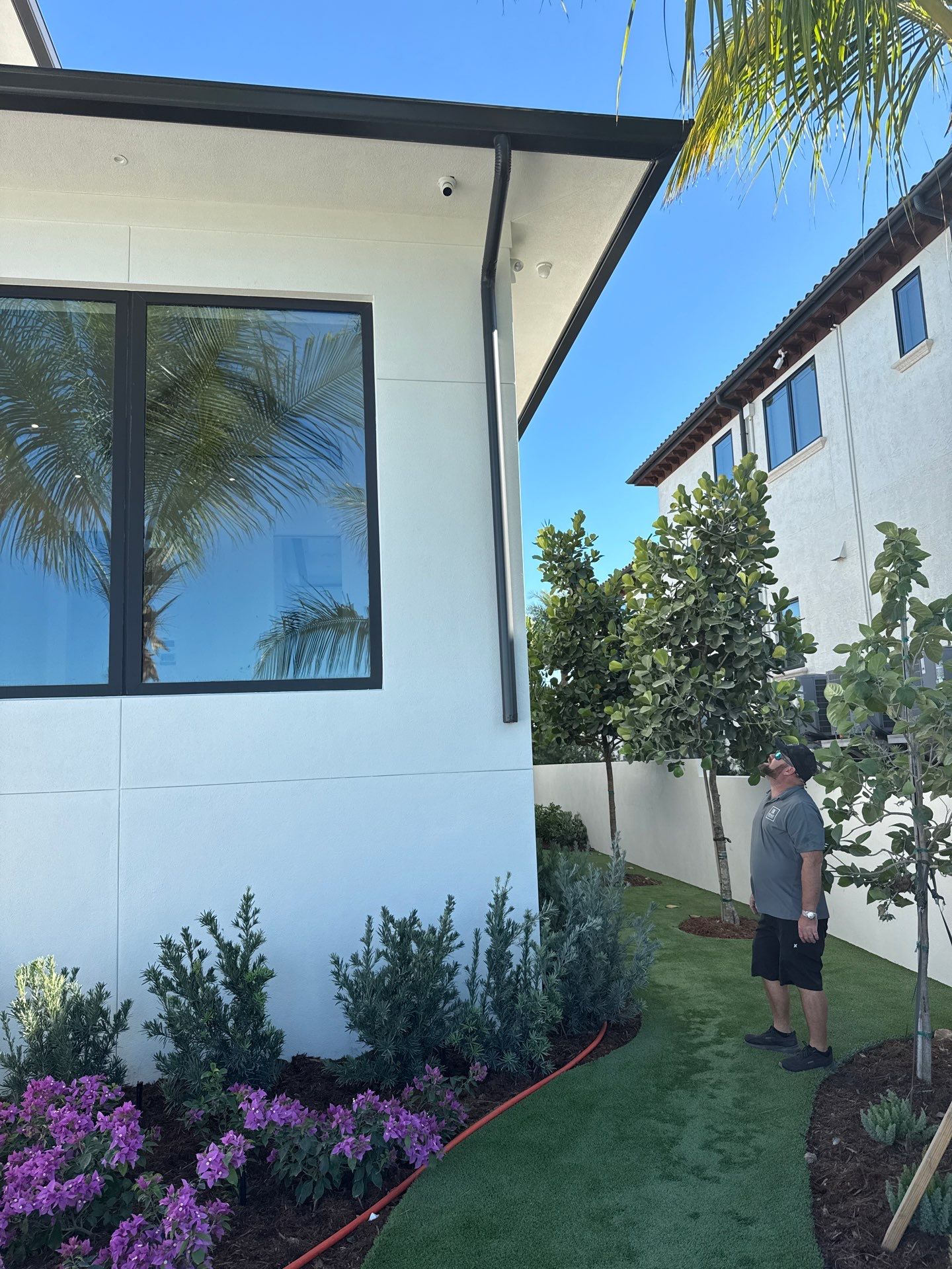 Seamless Aluminum Gutter Installation using black seamless gutters in Sarasota FL by Gutter Professors