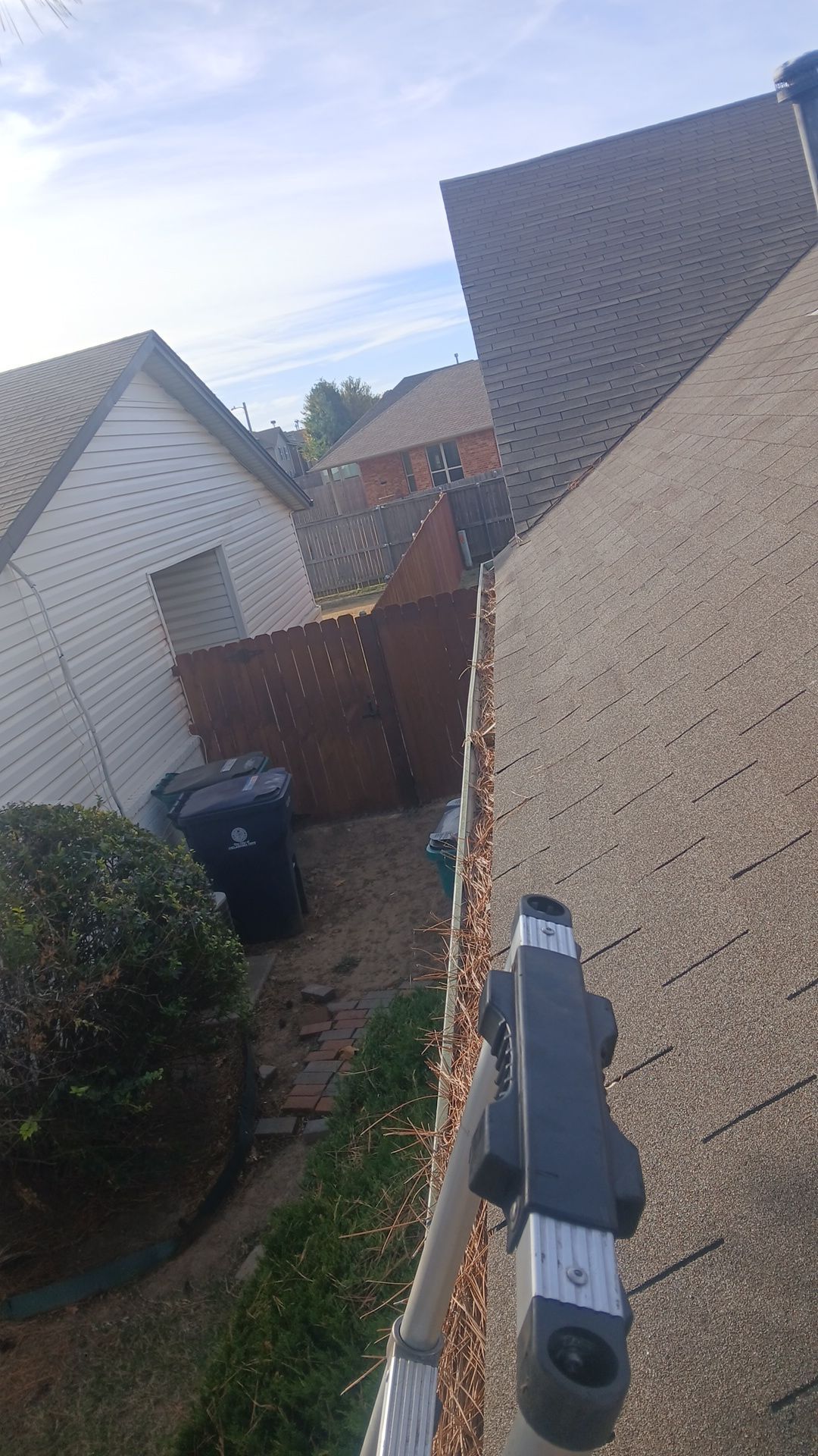Commercial gutter cleaning Oklahoma City before photo with filled gutters
