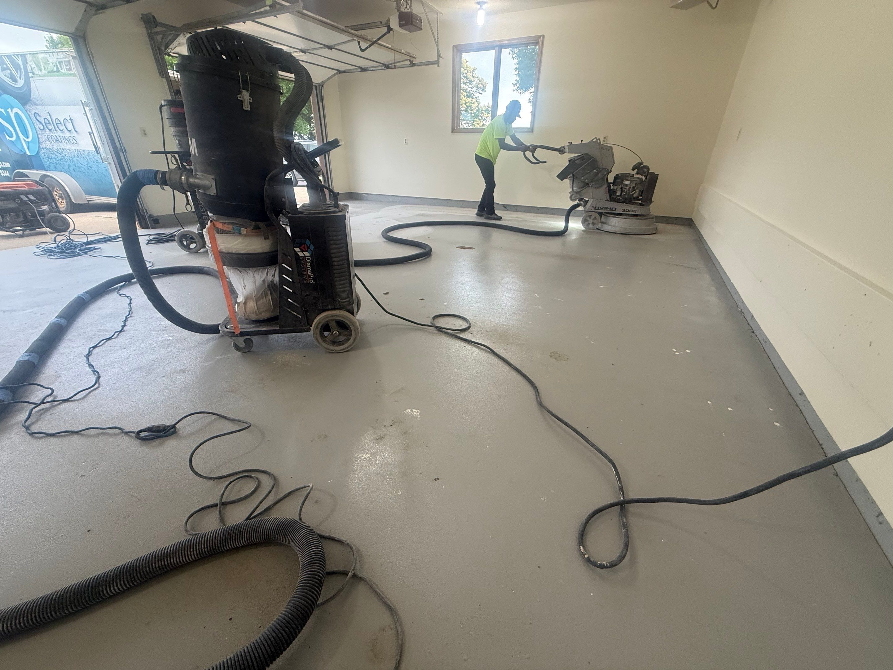 Custom Polyaspartic Garage Floor and Stairwell Coating in Pipestone by Select Painting, Coatings & Garage Cabinets