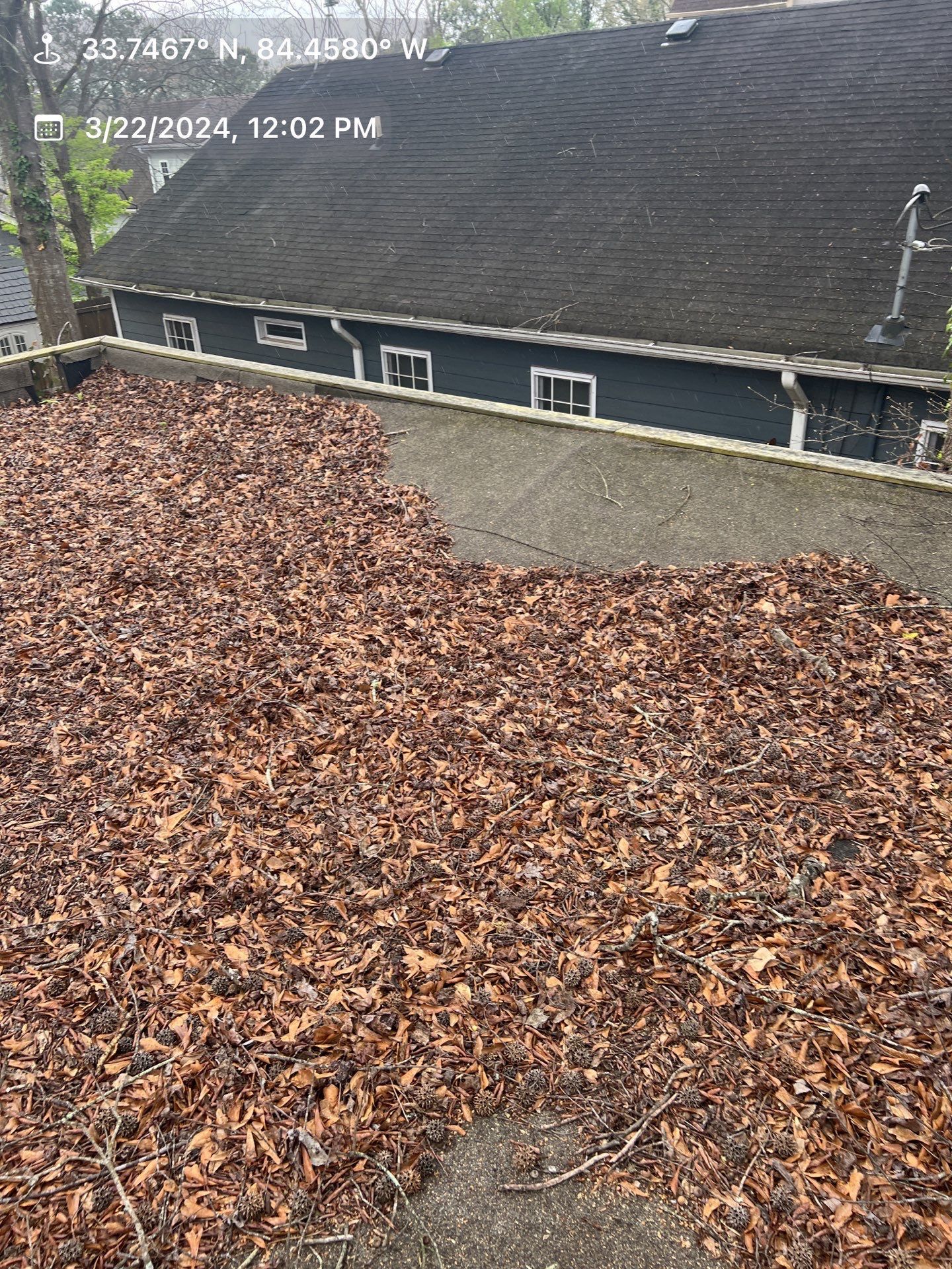 Gutter Cleaning using brown bags by Roof Bullies
