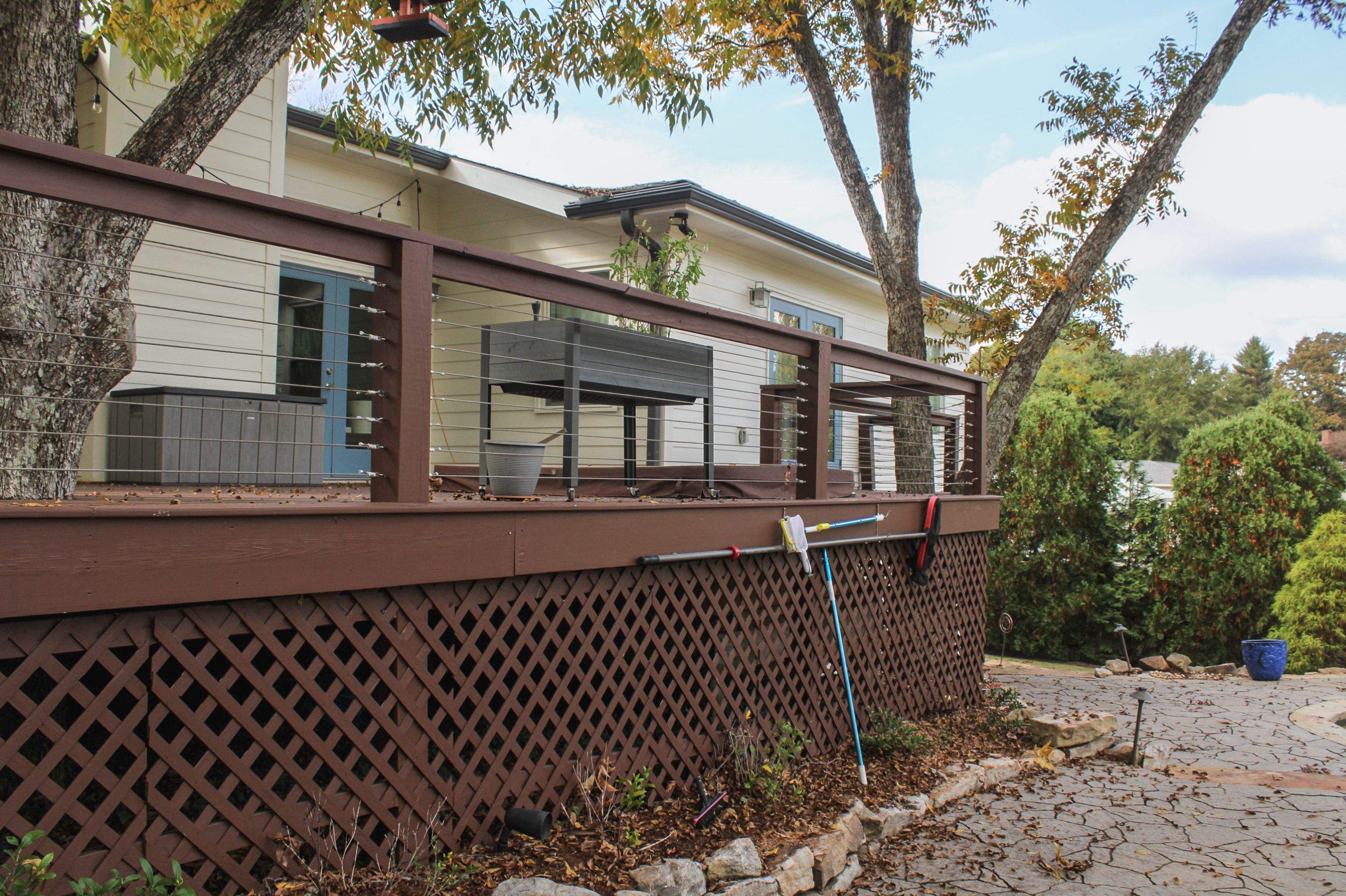 Deck Resurface with Glass Paneling and Deckorators Voyage Series Products by Nelson Exteriors 