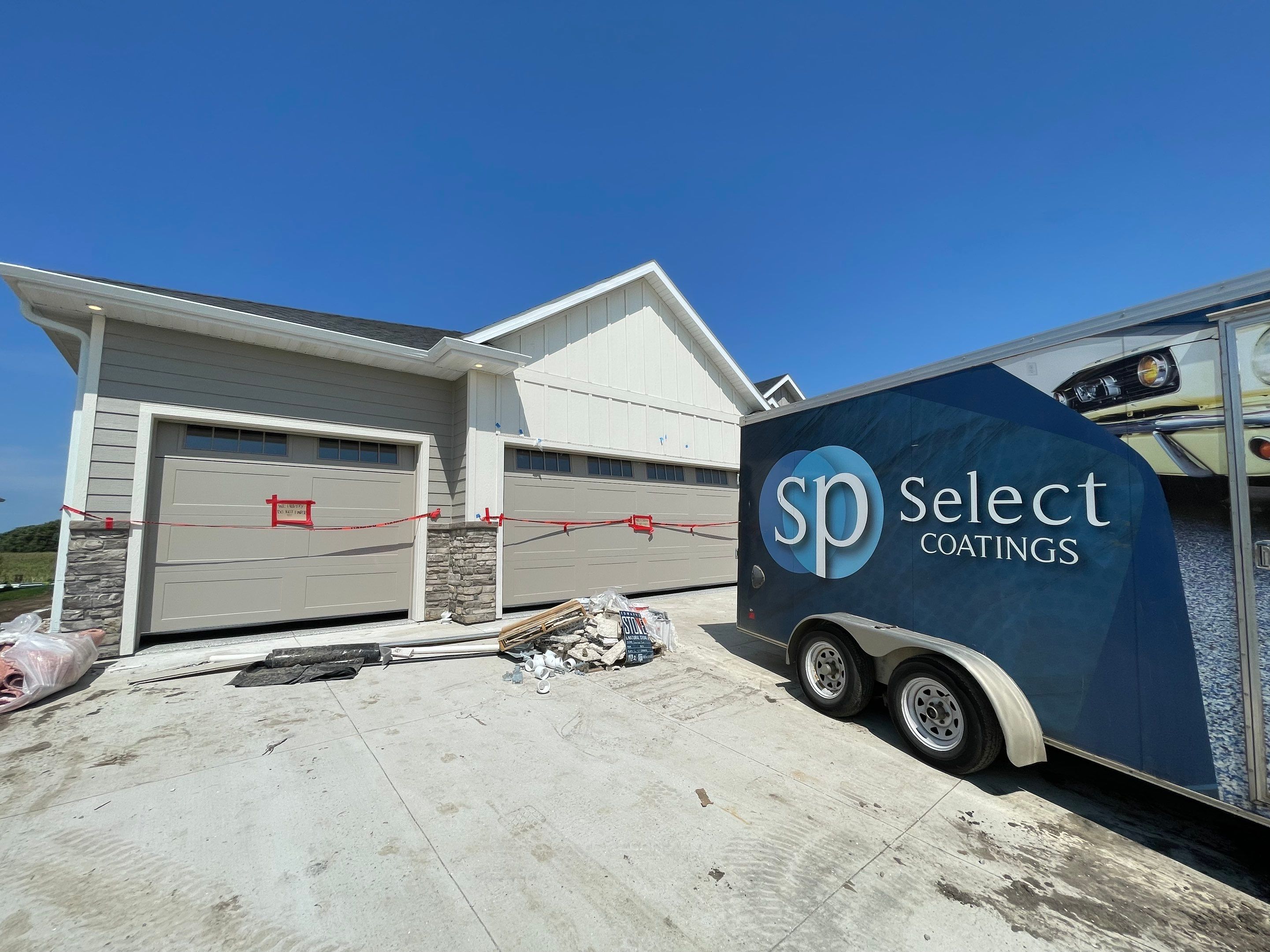 Grey Speckled Garage Floor Coating in Sioux Falls by Select Painting, Coatings & Garage Cabinets