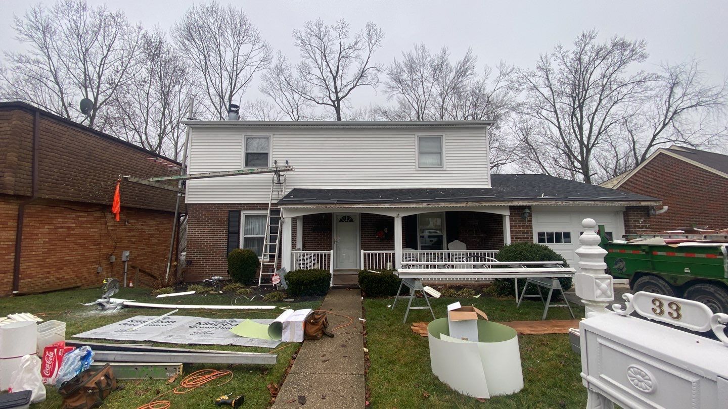 Replace dated vinyl siding with new white exterior Portfolio vinyl siding  by Secure Construction Company Inc