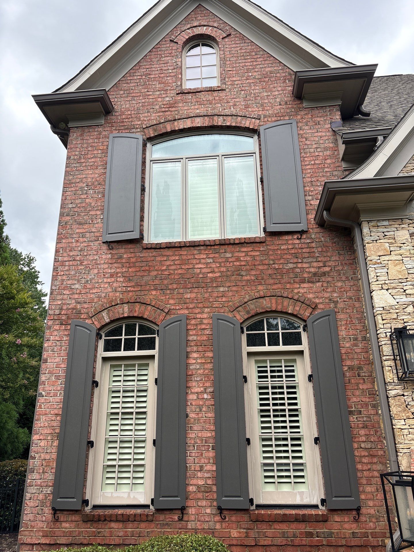 Exterior raised panel shutters by Southern Traditions Window Fashions