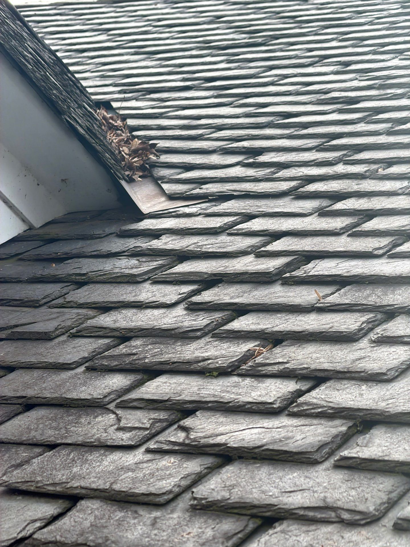 Slate Roof Restoration and Copper Ridge Cap Install in Richmond by Cade Construction
