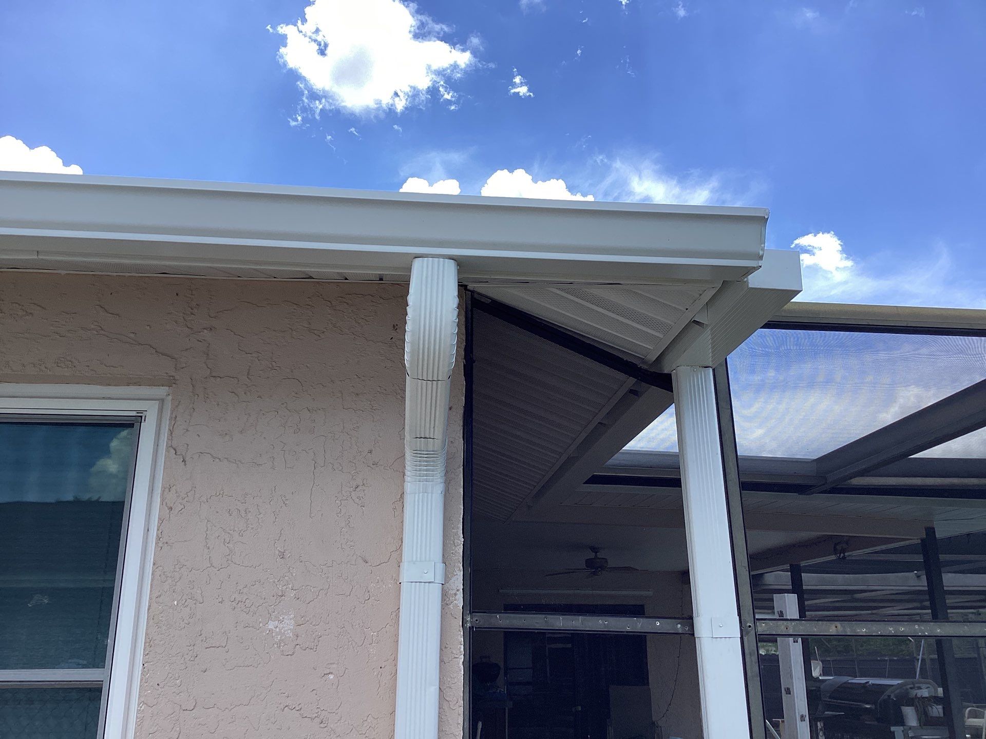 White Seamless Gutters and Splash Guards in Fort Myers FL by Gutter Professor by Gutter Professors