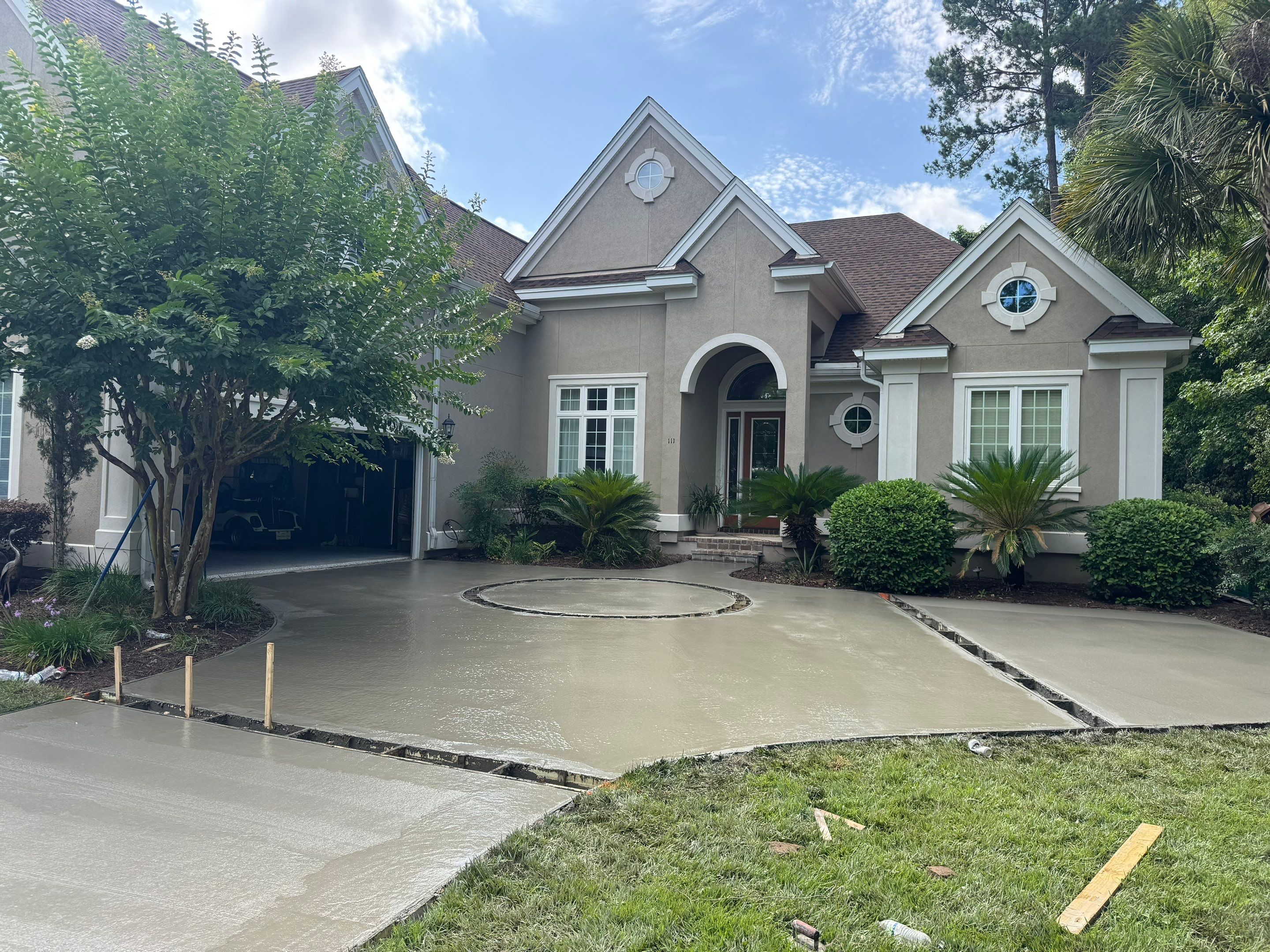 Custom Concrete Driveway and Decorative Paver Installation in Bluffton by Lowcountry Scapes, LLC