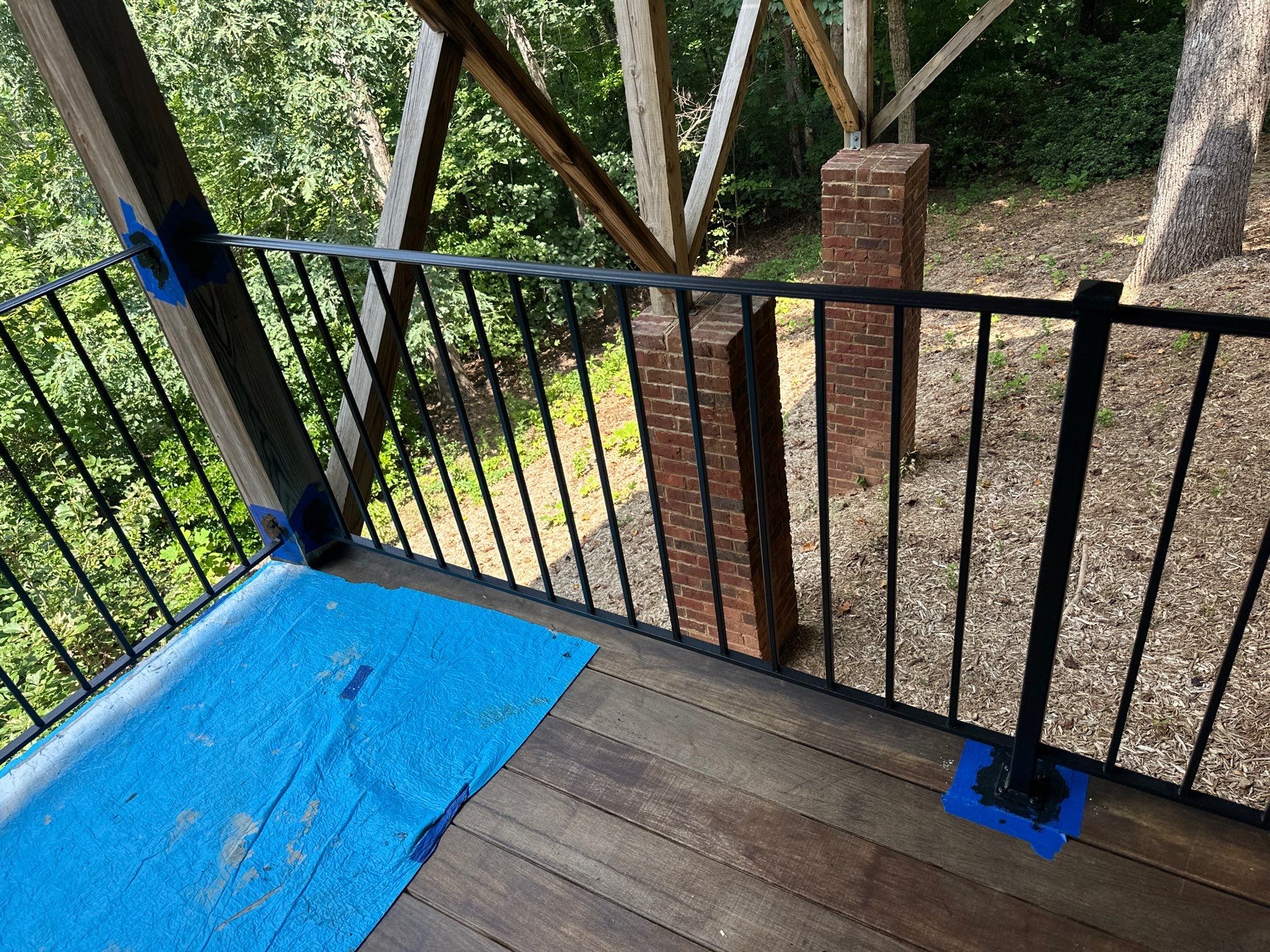 Wood Deck Refinishing and Black Metal Railing Upgrade in Travelers Rest by Painter1