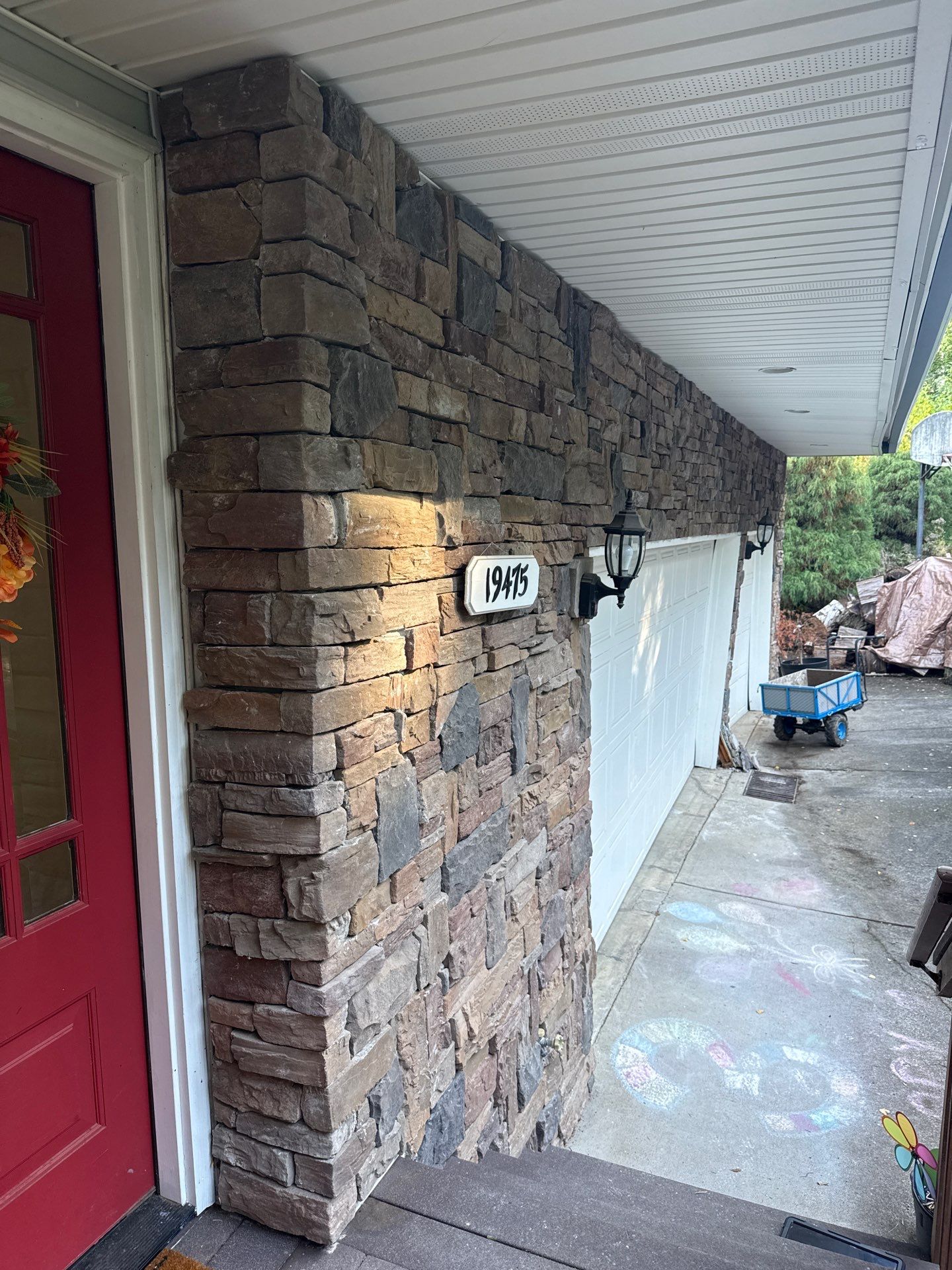 Damascus Garage Exterior Repair and Stacked Stone Veneer Installation by American Made Construction 