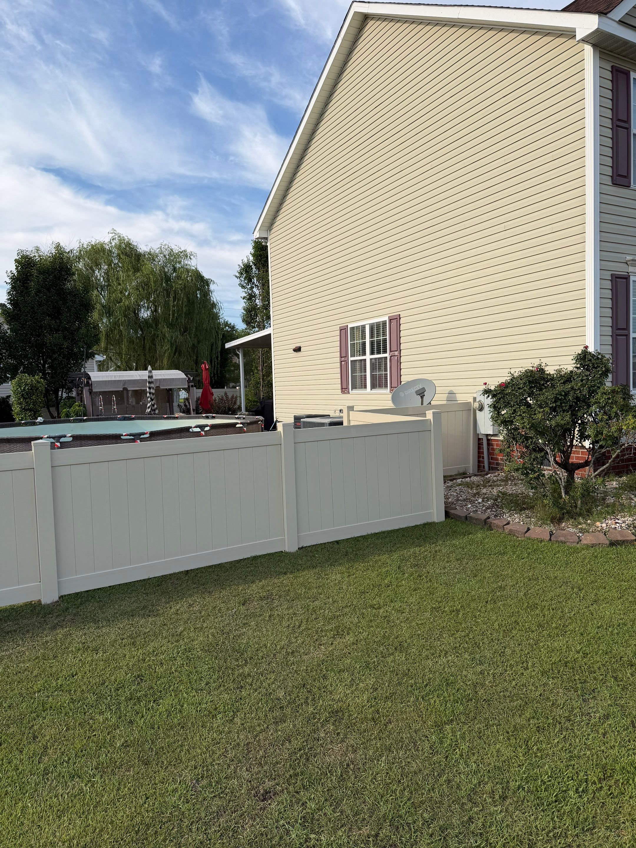 Residential Tan Vinyl Privacy Fence Installation in Winterville by Superior Fence and Rail