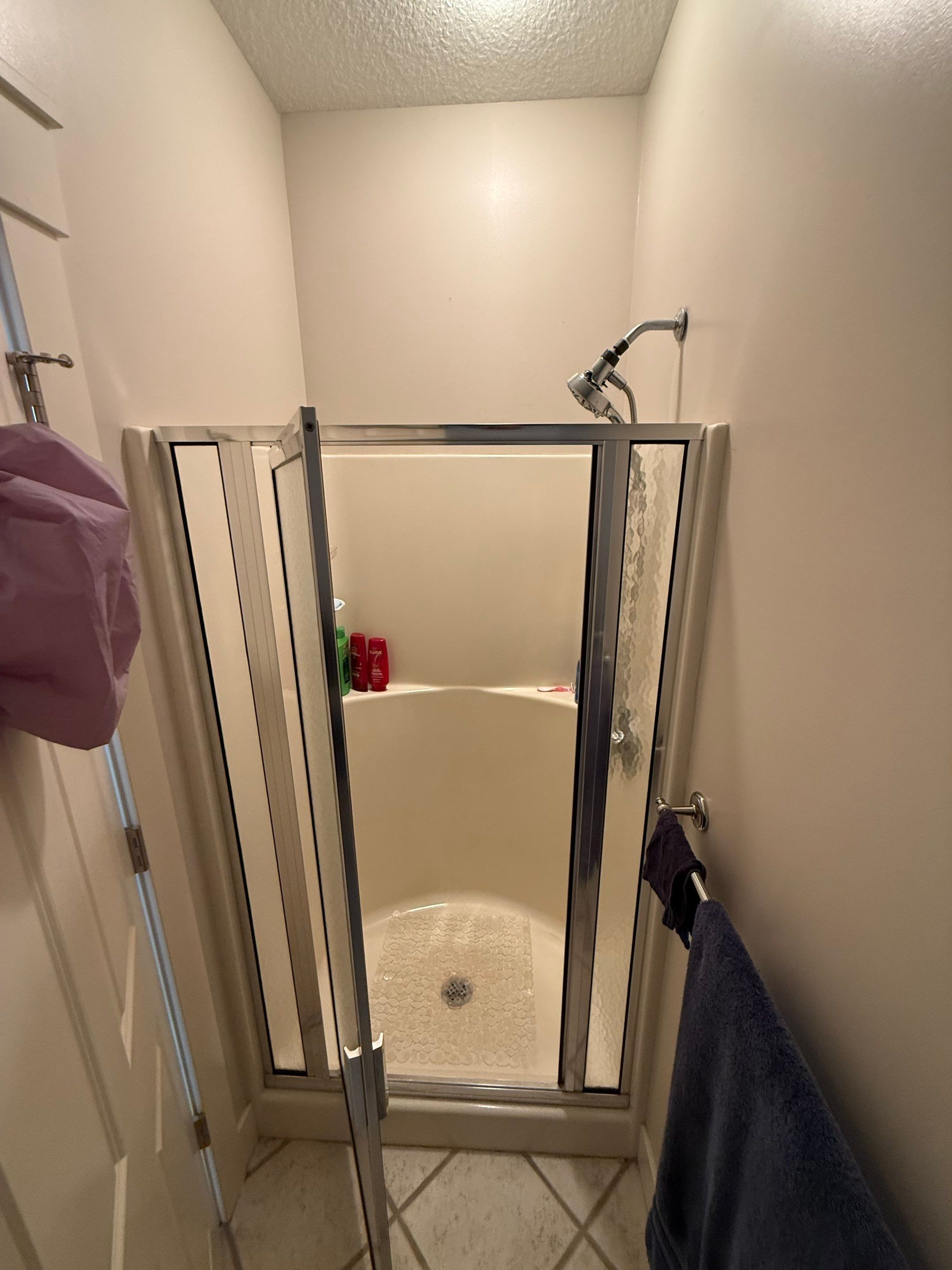 East Jordan Walk-In Shower Remodel with Folding Bench and Chrome Fixtures by Rainbow Seamless Systems
