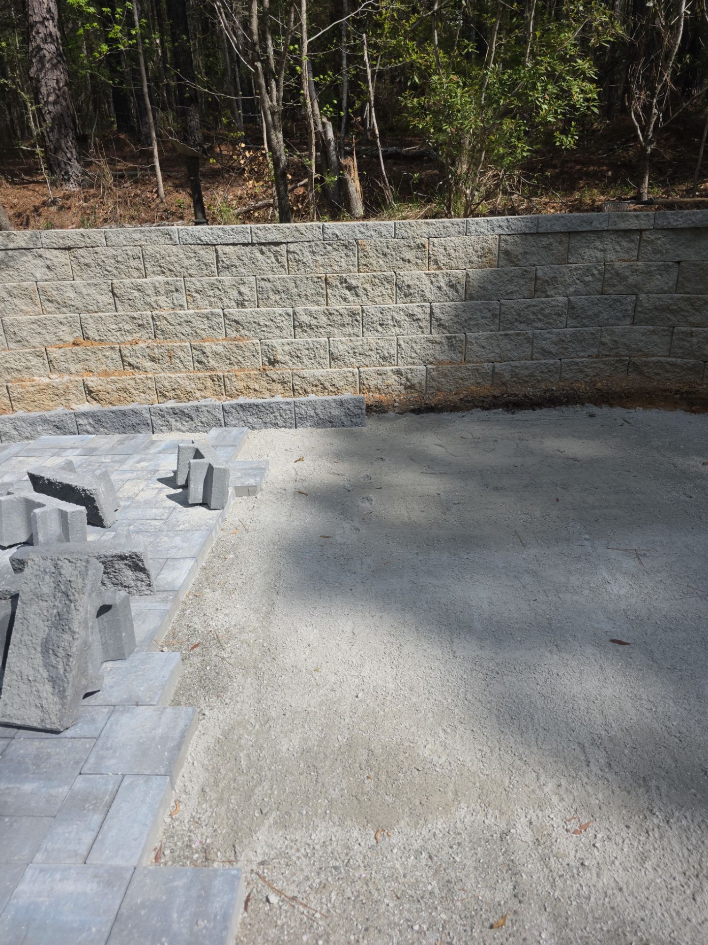 Pittsboro Outdoor Living Transformation – Retaining Wall, Paver Patio & Elevated Deck by Elite Remodeling and Design LLC