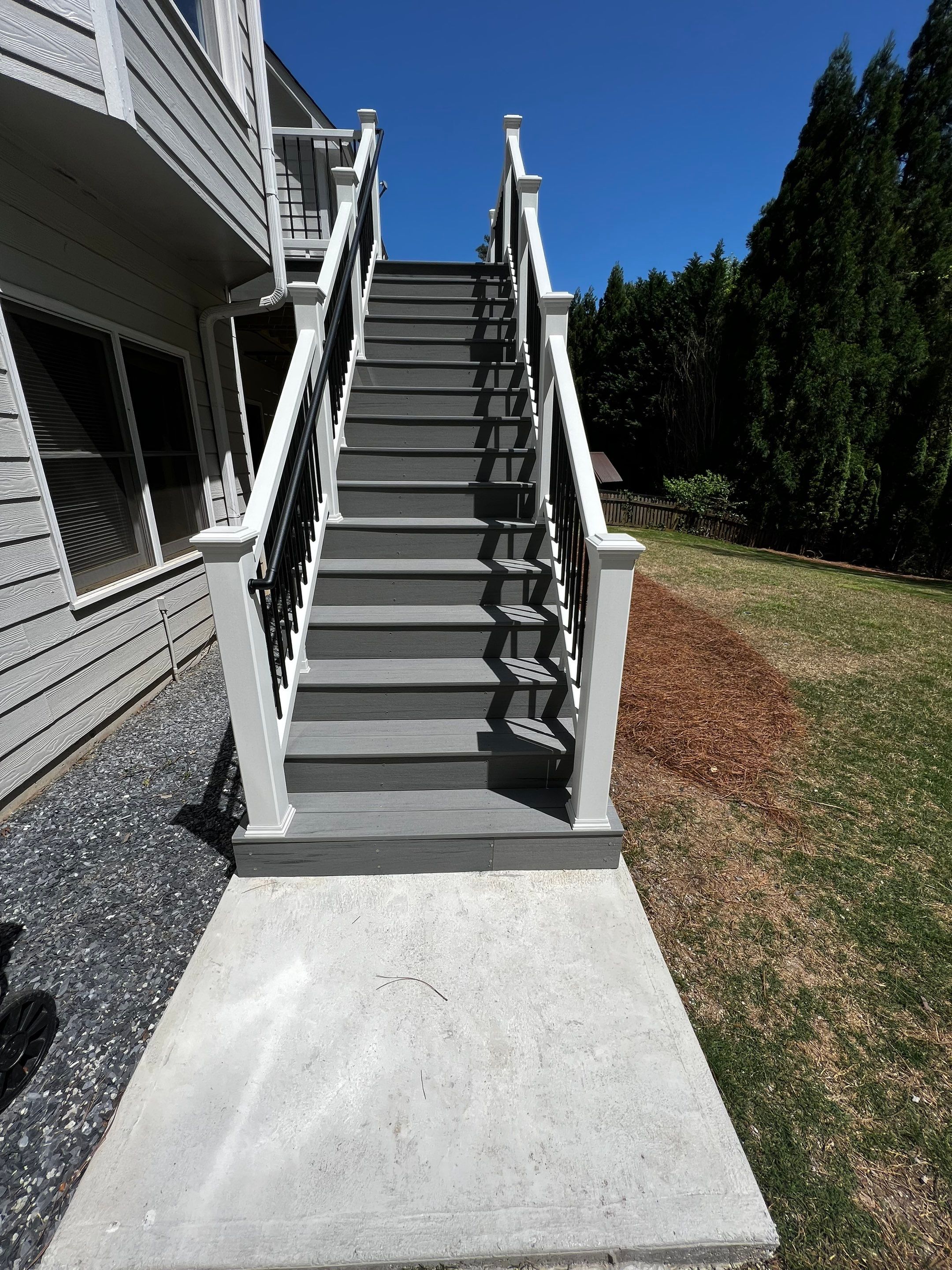 Elevated Grey Composite Deck Installation in Woodstock by Swift Home Renovations 