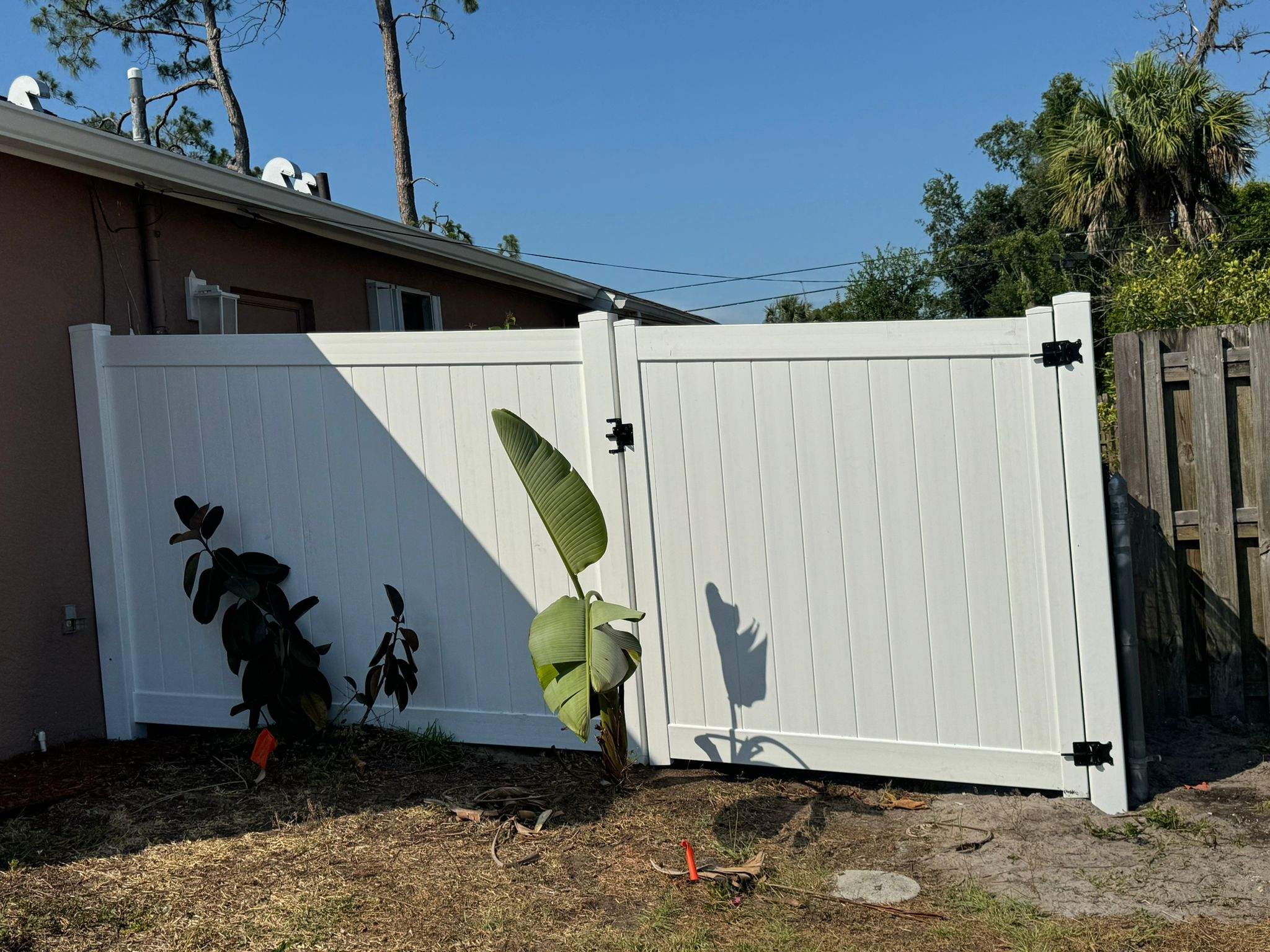 White Vinyl Privacy Fence and Gate Repair in North Port by True Fence LLC