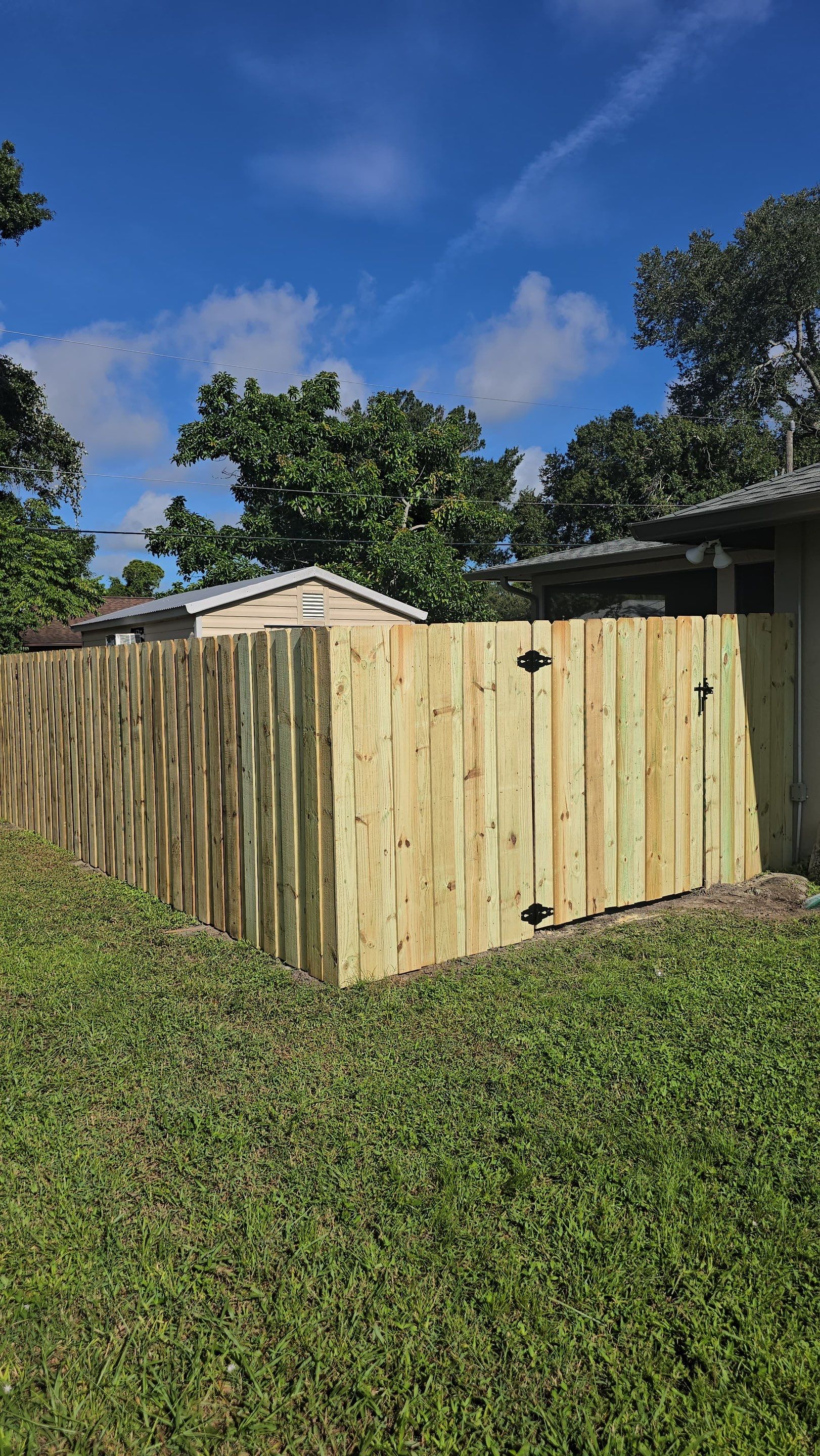 Pressure-Treated Wood Privacy Fence and Gate Installation in North Port by True Fence LLC
