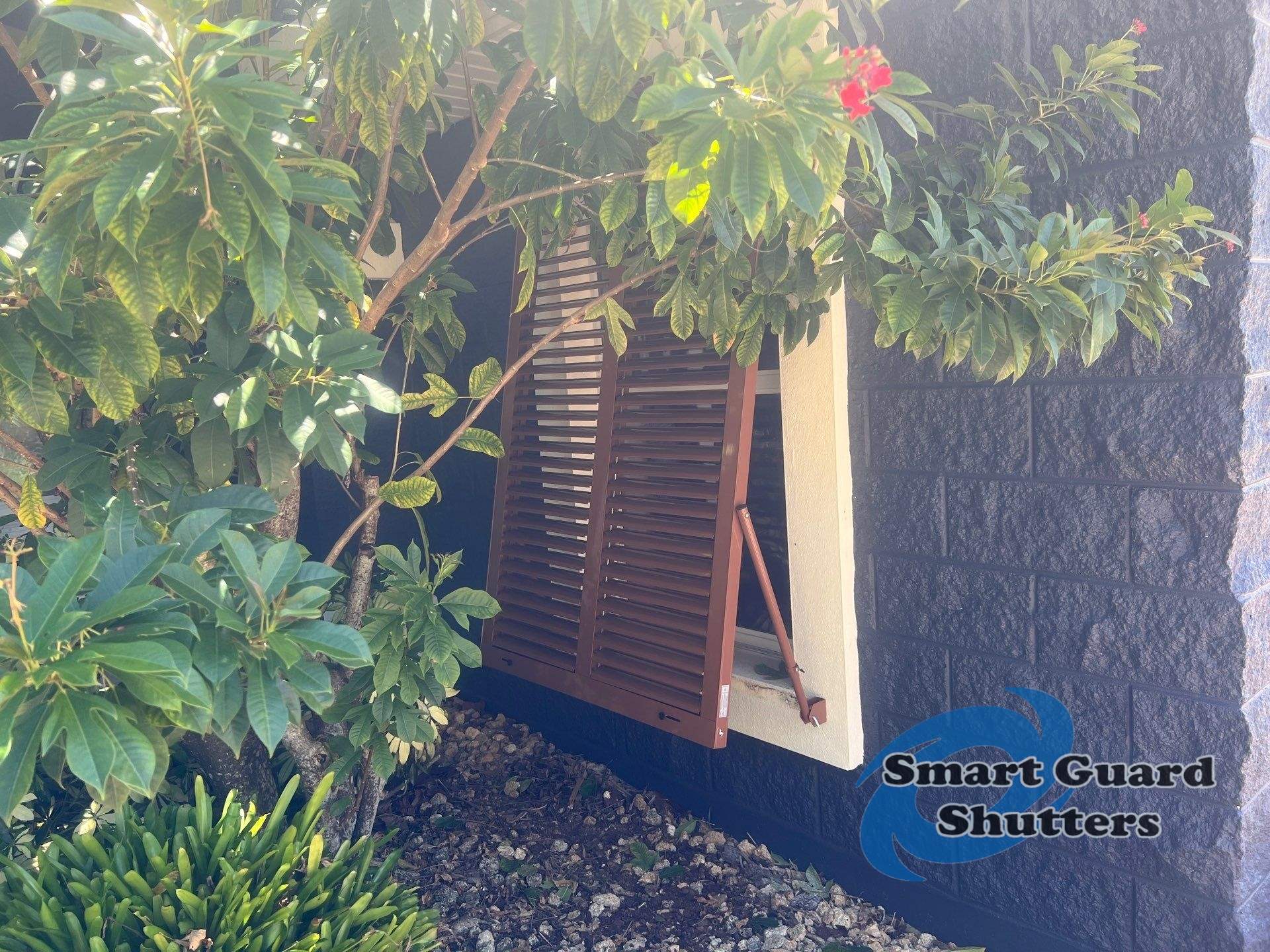 Impact Rated Bahama Shutters in Beige Brown by Smart Guard Shutters