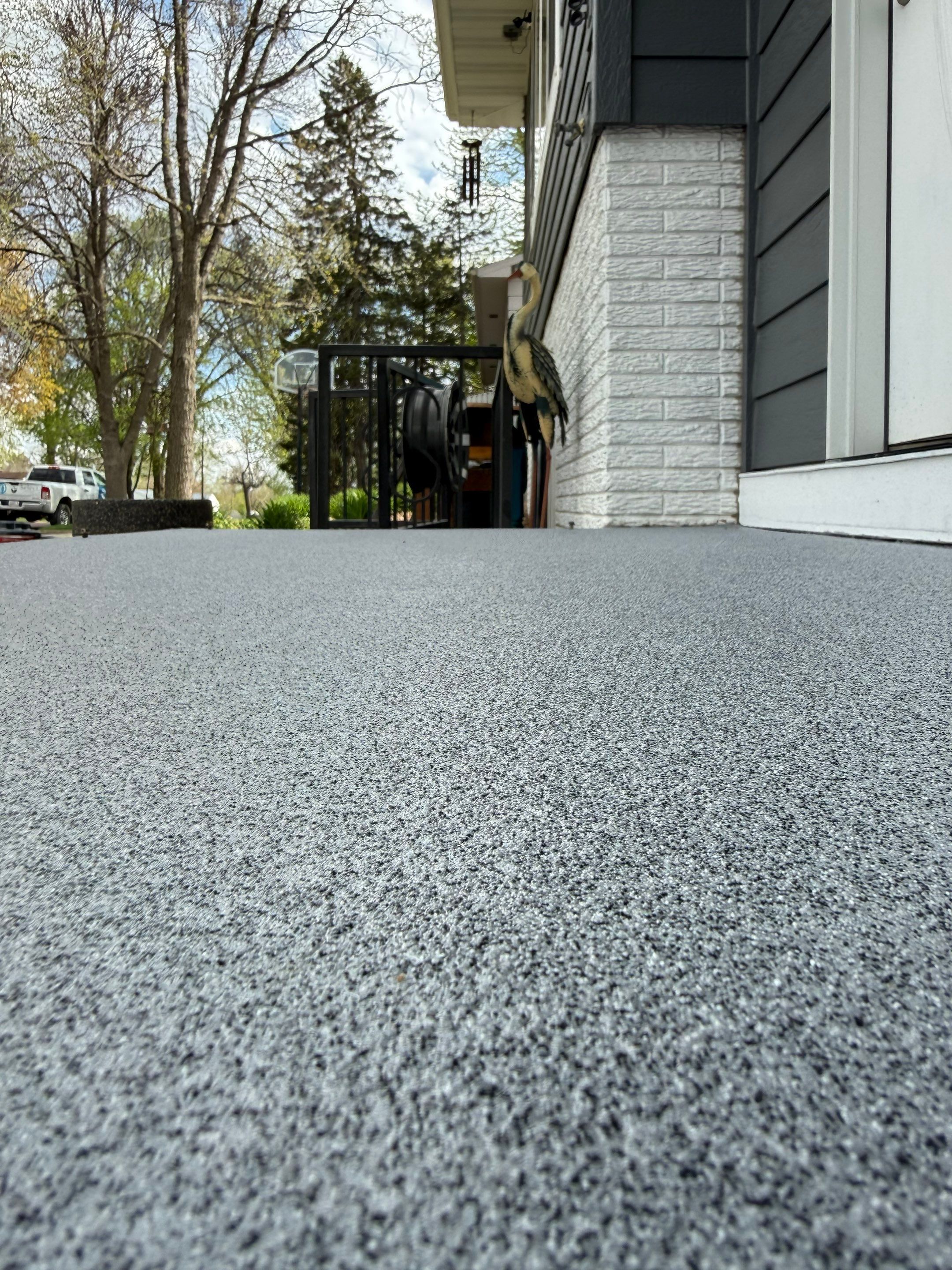 Grey Polyaspartic Porch and Stair Resurfacing in Sioux Falls by Select Painting, Coatings & Garage Cabinets