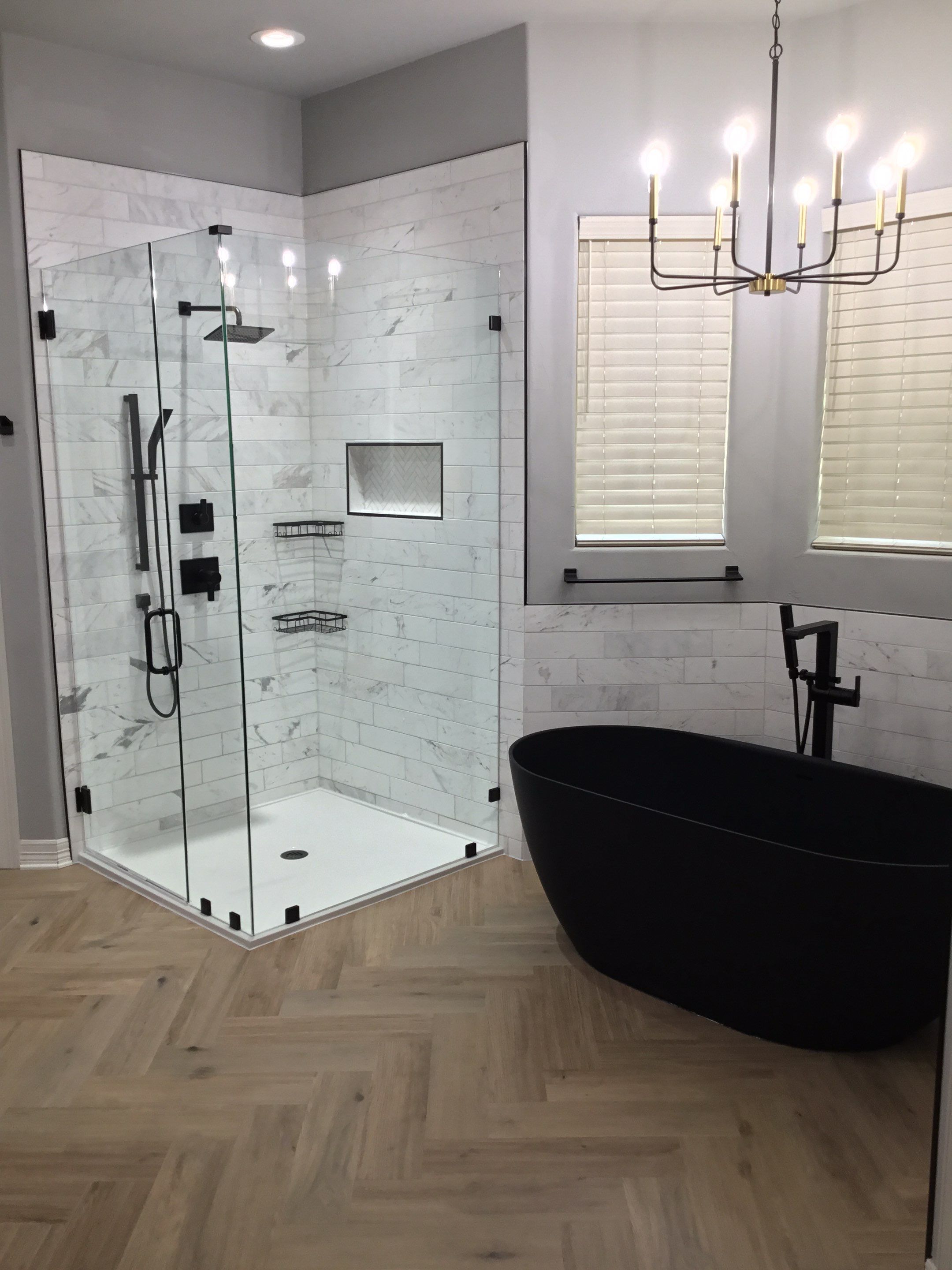 Spring Bathroom Remodel with Black Free-Standing Tub and Walk-In Shower by Legacy Bath and Kitchen